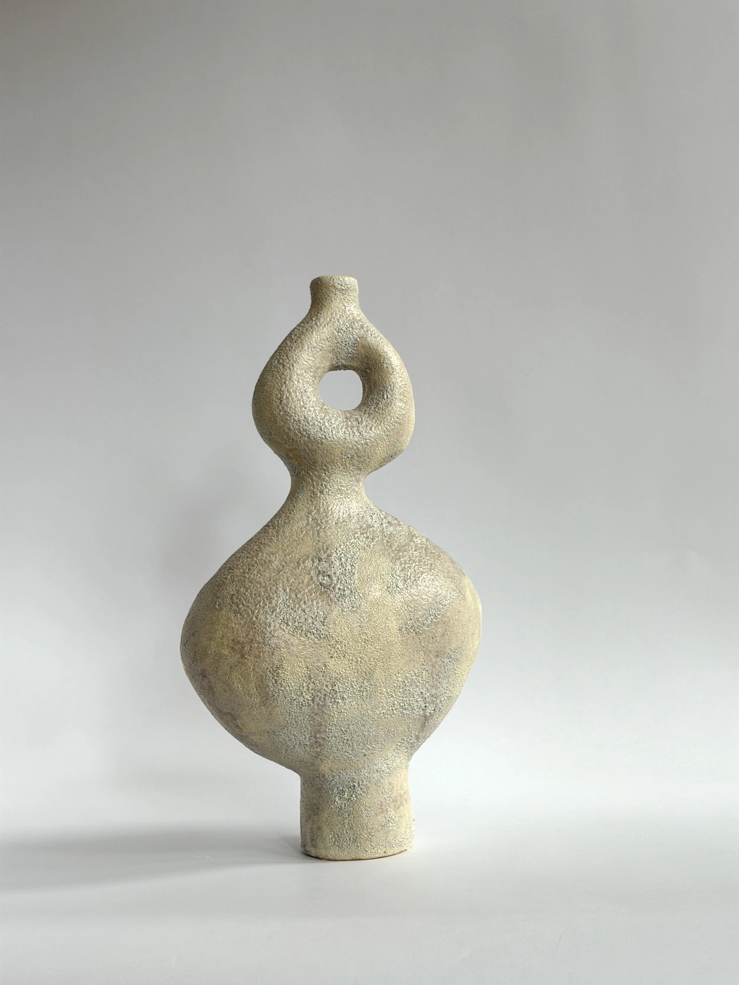 Hand-built ceramic vase set: Dancers Vase Set, of rounded forms caught mid-motion, rising to looped openings — Anastasia Babenko