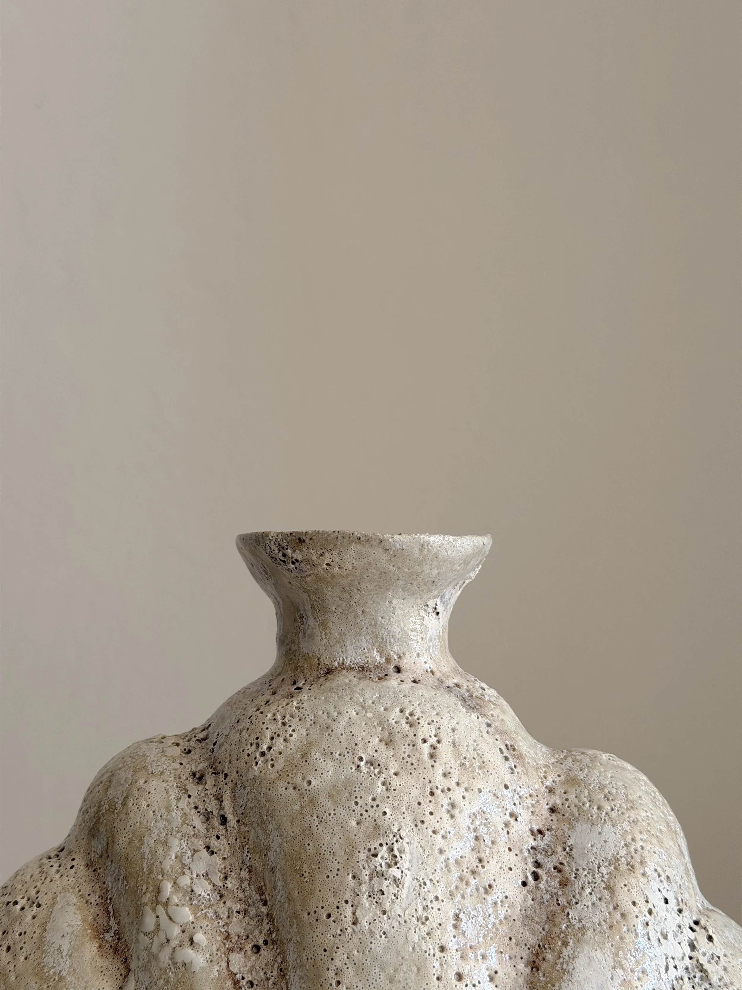 Shell in Beige by Anastasia Babenko — shaped like a deep-sea shell, full and protective, in soft beige stoneware, original ceramic art for