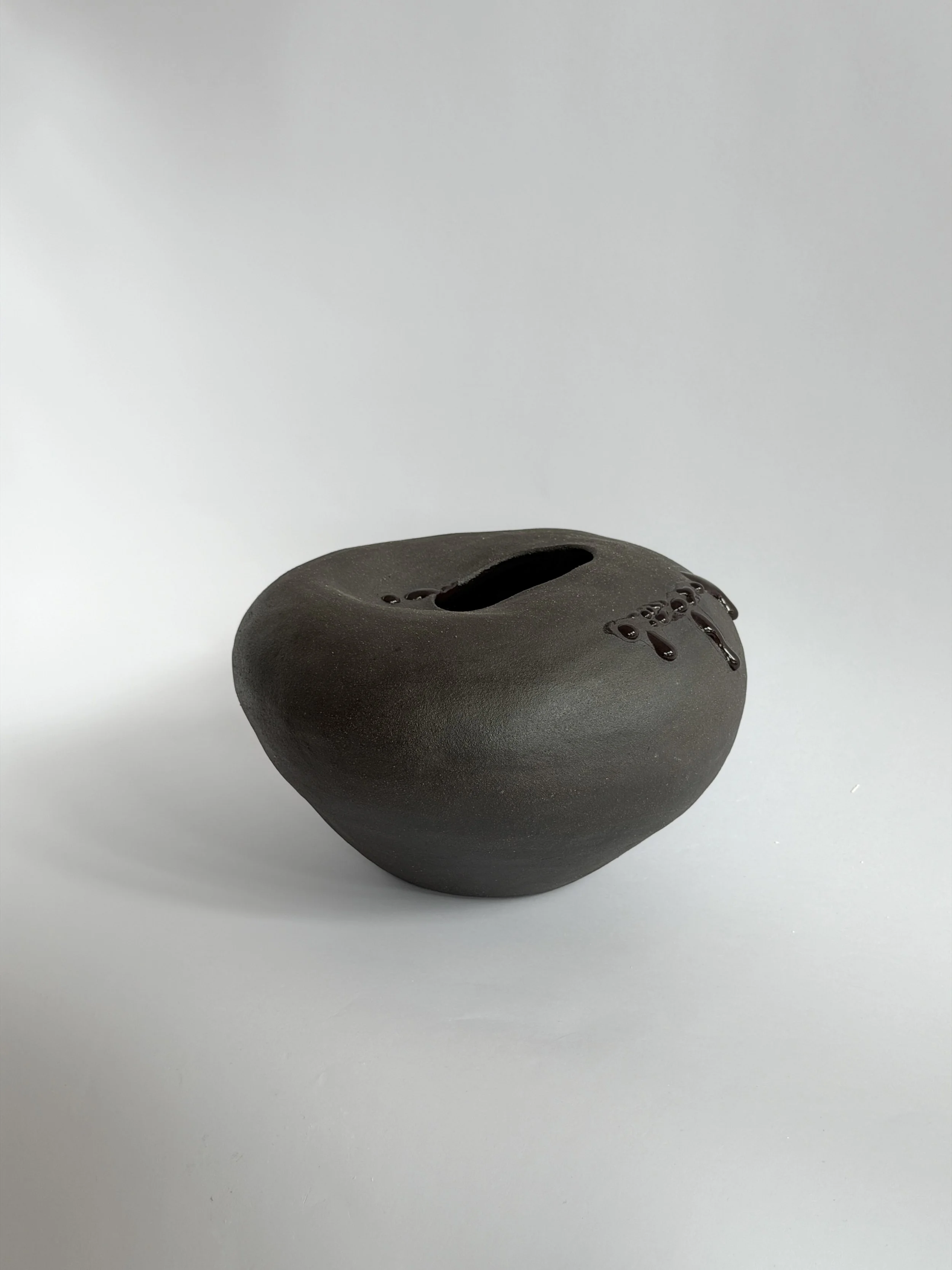 Hand-built ceramic vase: Whispering Stone, shaped like a smooth river stone, organic and calming — Anastasia Babenko