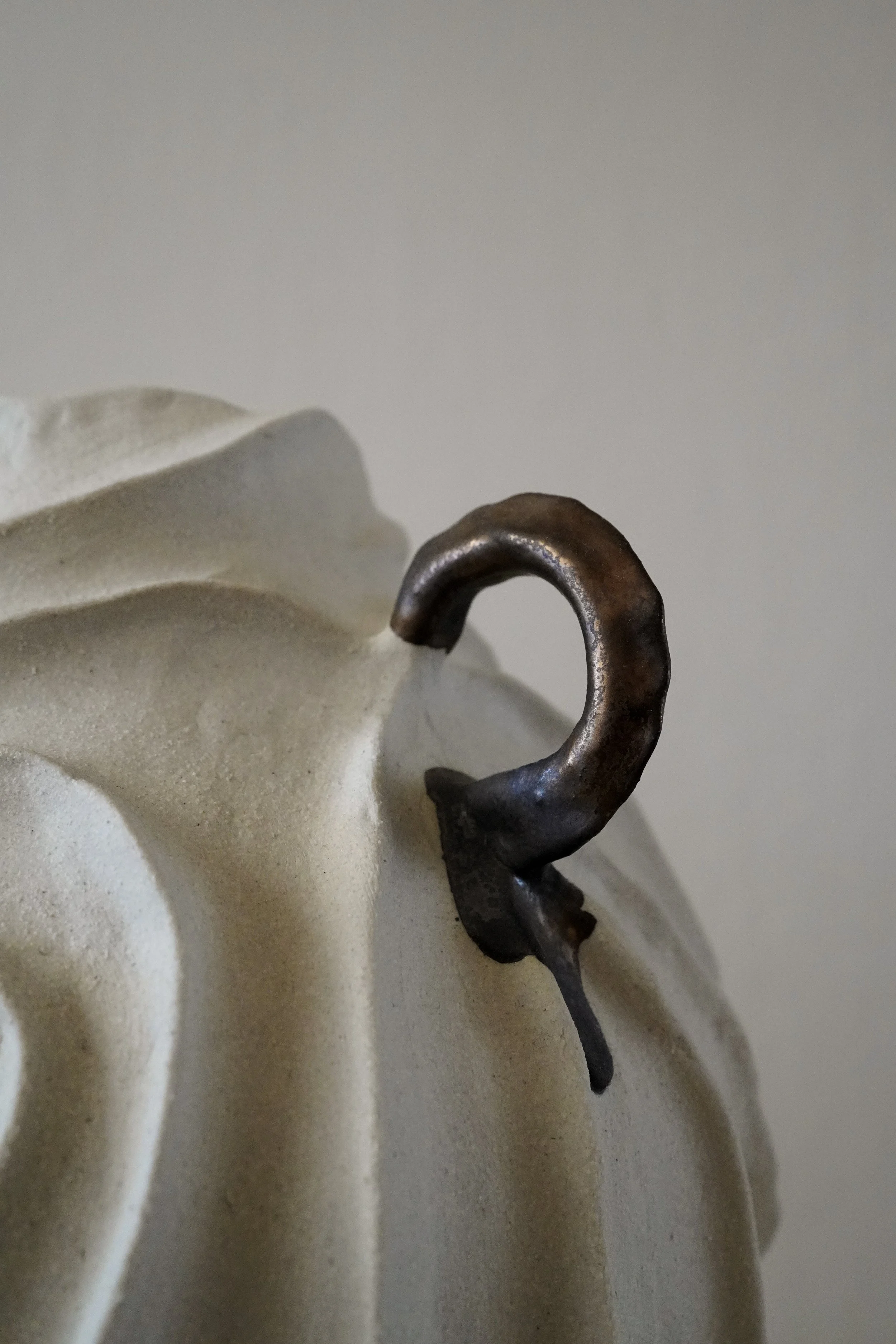 Hand-built ceramic vase: Alabaster No. 1, carved all over with flowing, swirling relief in pale matte stoneware — Anastasia Babenko