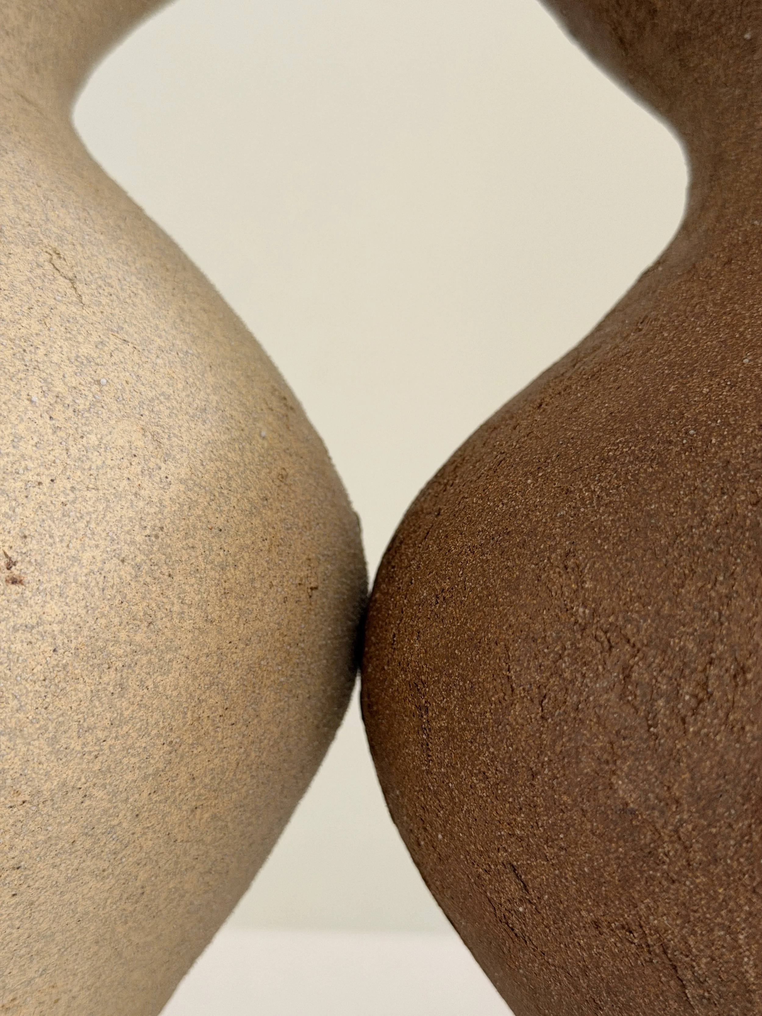 Hand-built ceramic vase: Silhouette Vase in Brown, tracing a woman's full, rounded silhouette in warm brown stoneware — Anastasia Babenko