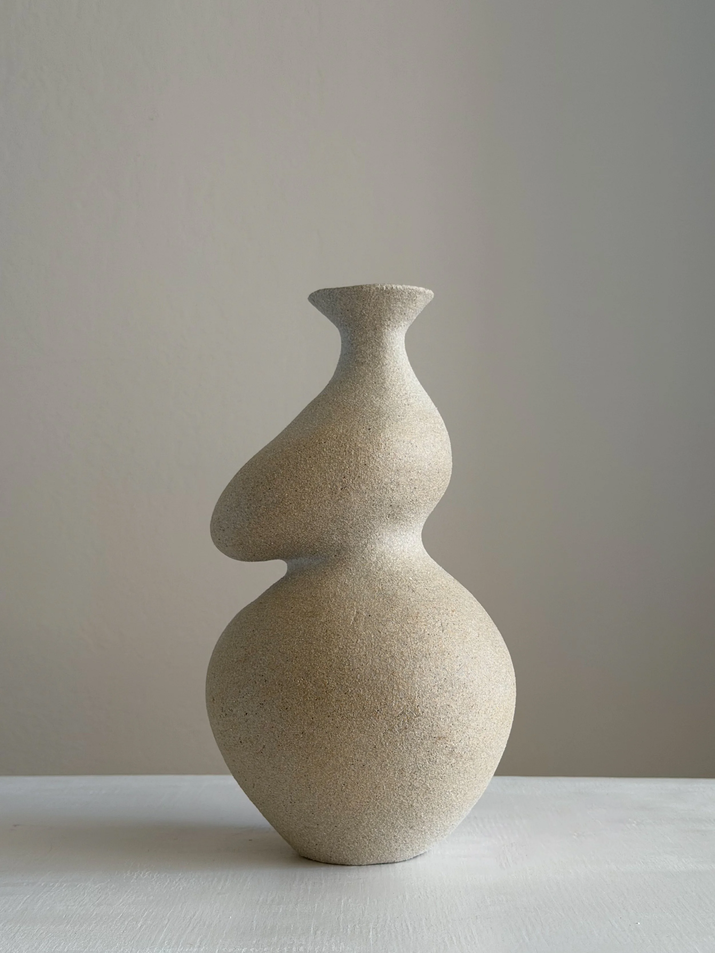She 4 by Anastasia Babenko — in the form of a woman with a full belly and soft hips shaped from clay, original ceramic art for interior designers