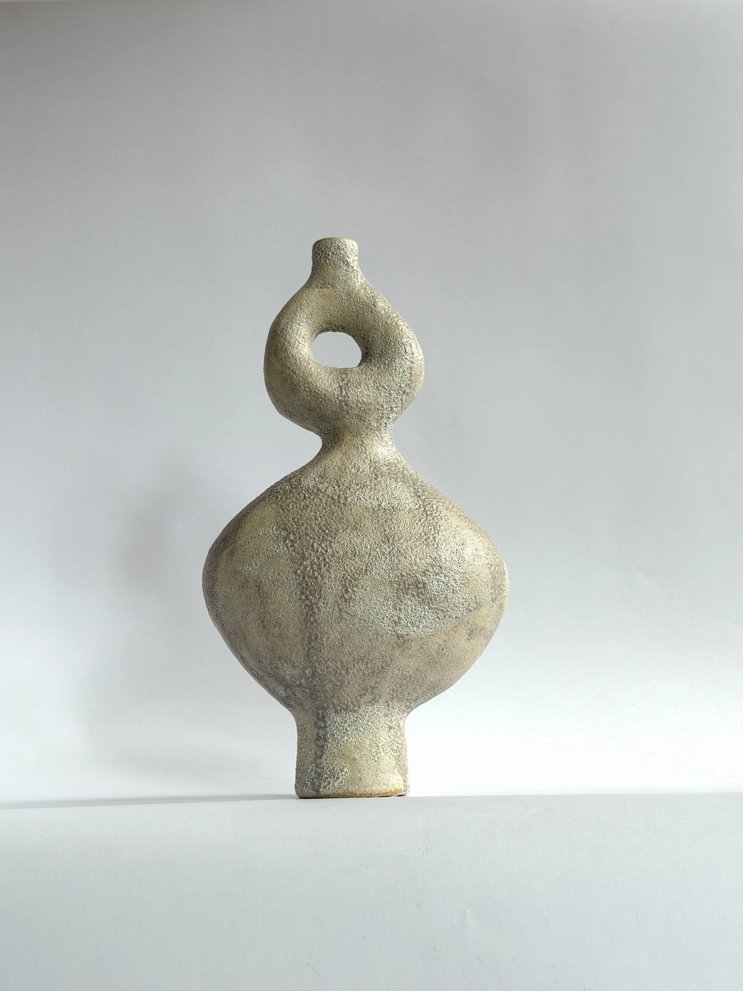 Dancers Vase Set — hand-built ceramic vase set of rounded forms caught mid-motion, rising to looped openings, by Anastasia Babenko