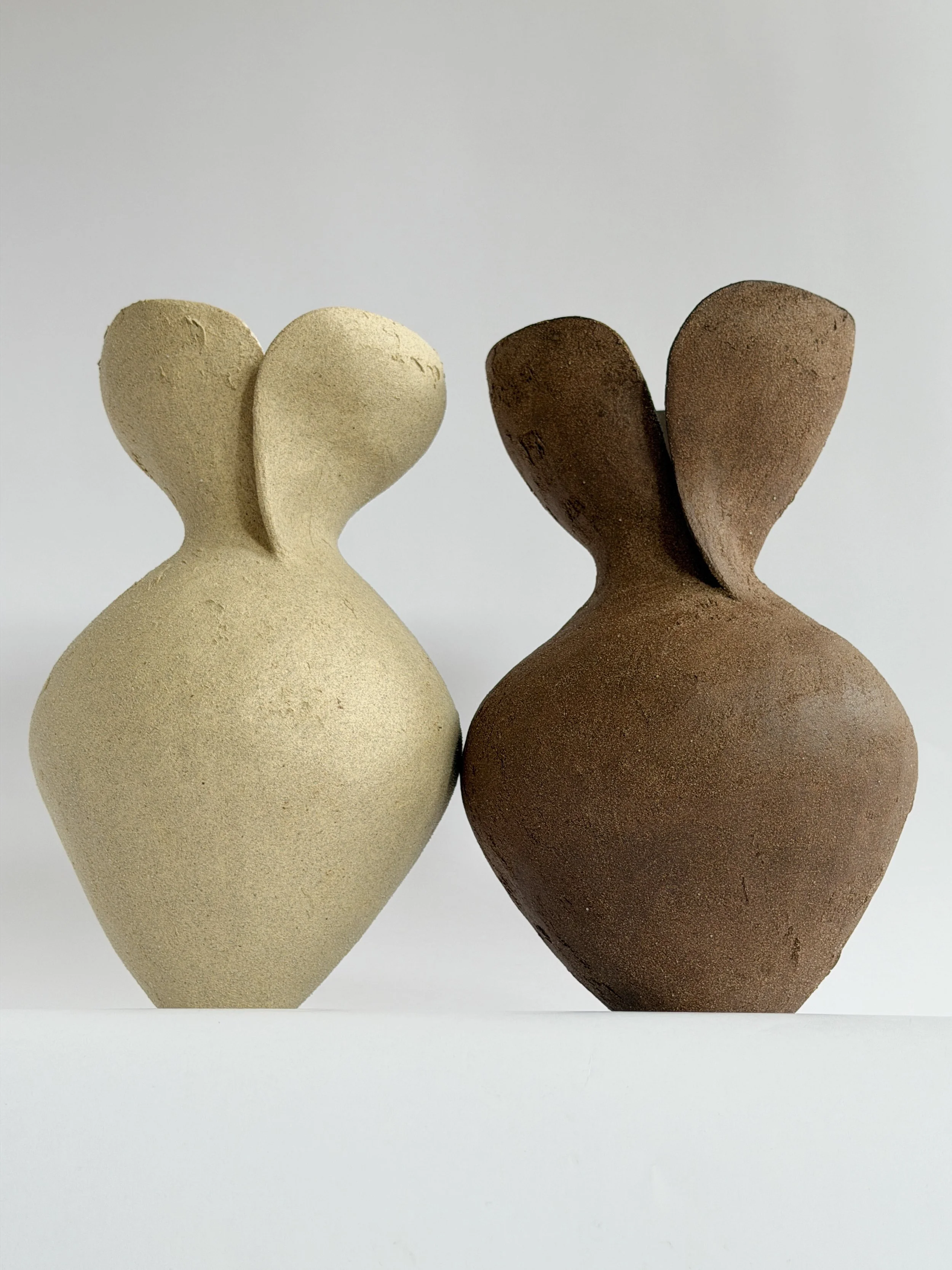 Silhouette Vase in Beige — hand-built ceramic vase tracing a woman's full, rounded silhouette in beige stoneware, by Anastasia Babenko