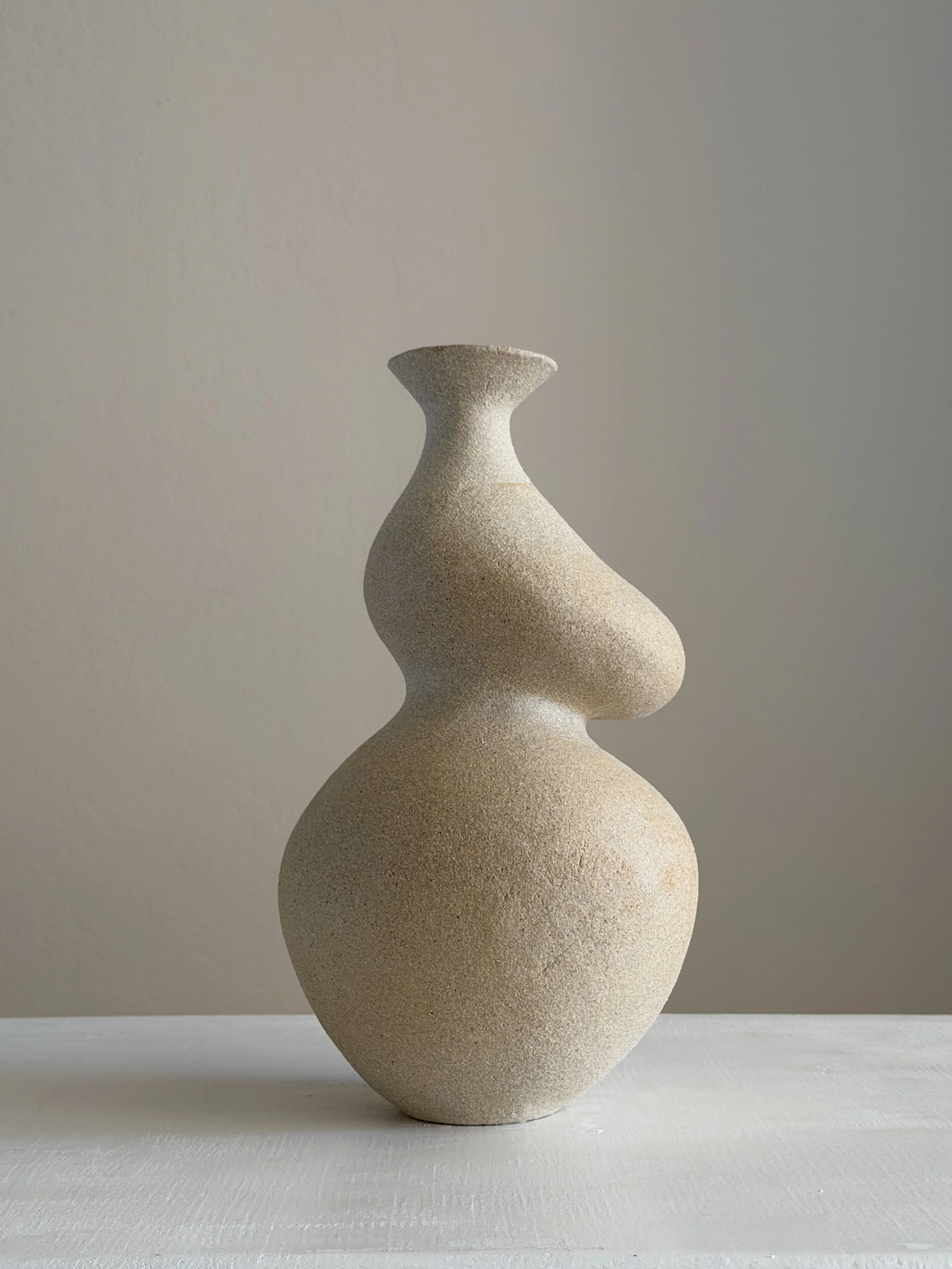 She 4, in the form of a woman with a full belly and soft hips shaped from clay — sculptural ceramic vase sculptural decor for design-led spaces
