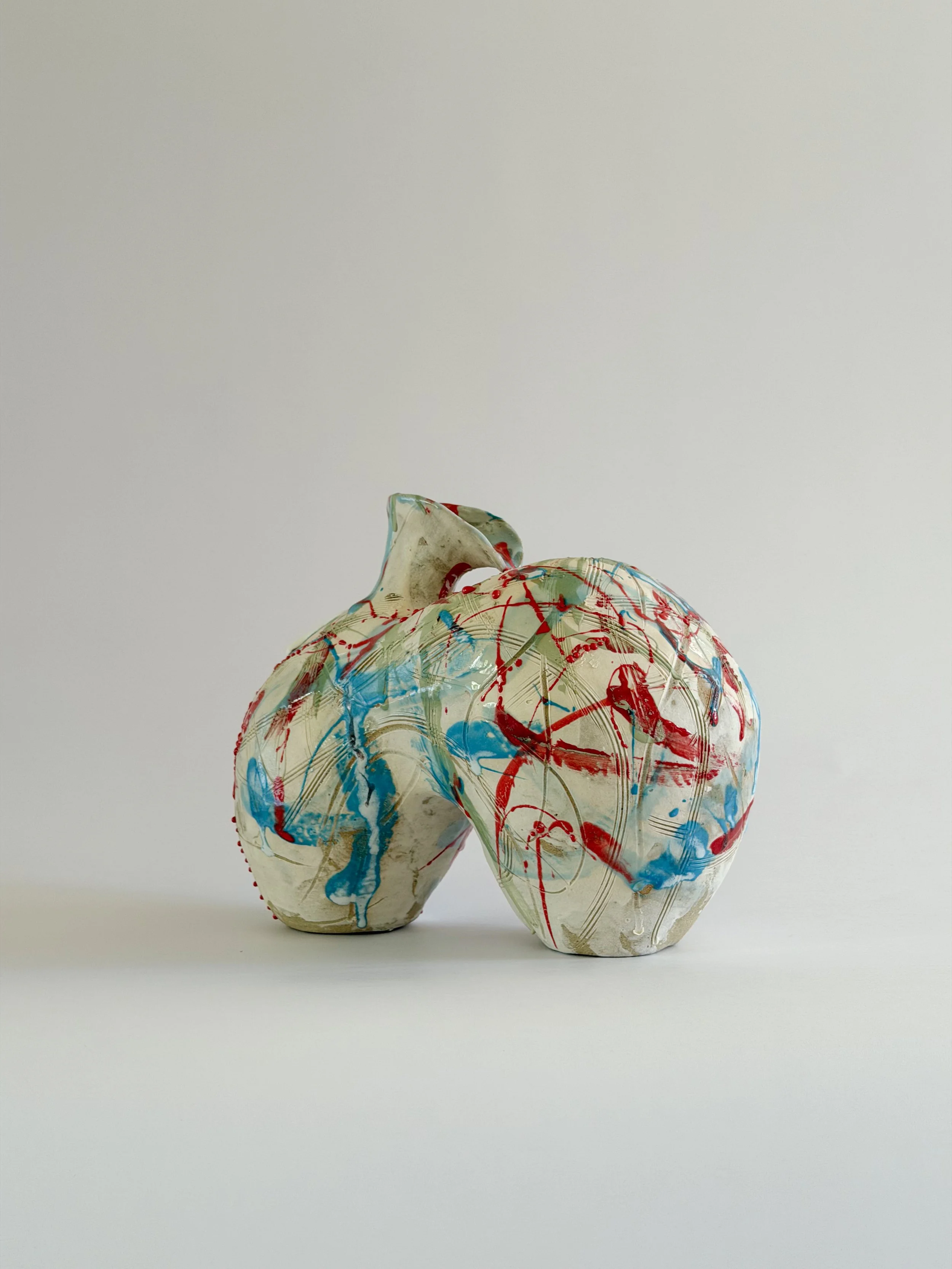 Form No. 2, with runny white glaze over red, turquoise and green and fine incised lines — sculptural ceramic vase made for considered,