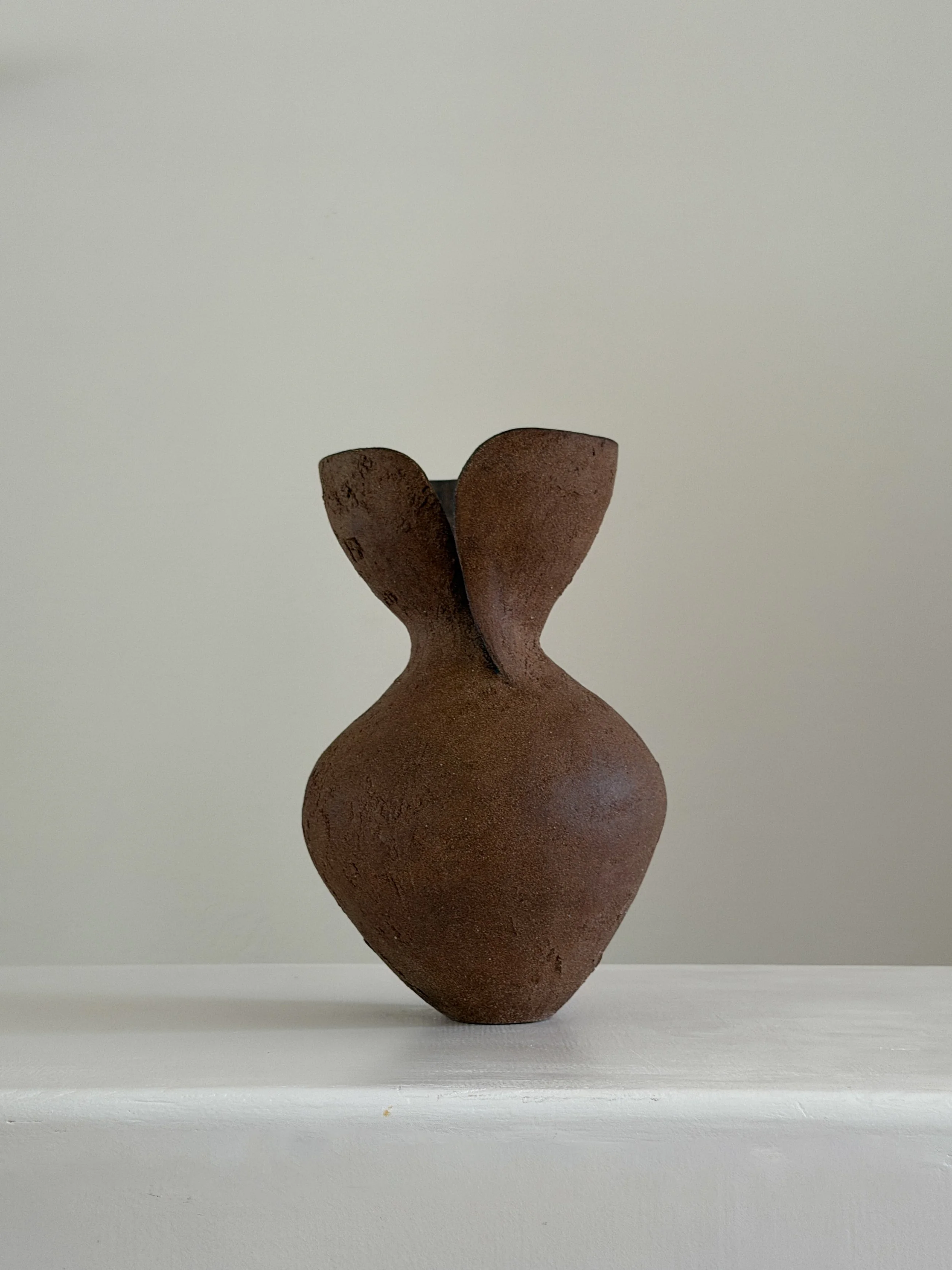 Silhouette Vase in Brown — hand-built ceramic vase tracing a woman's full, rounded silhouette in warm brown stoneware, by Anastasia Babenko