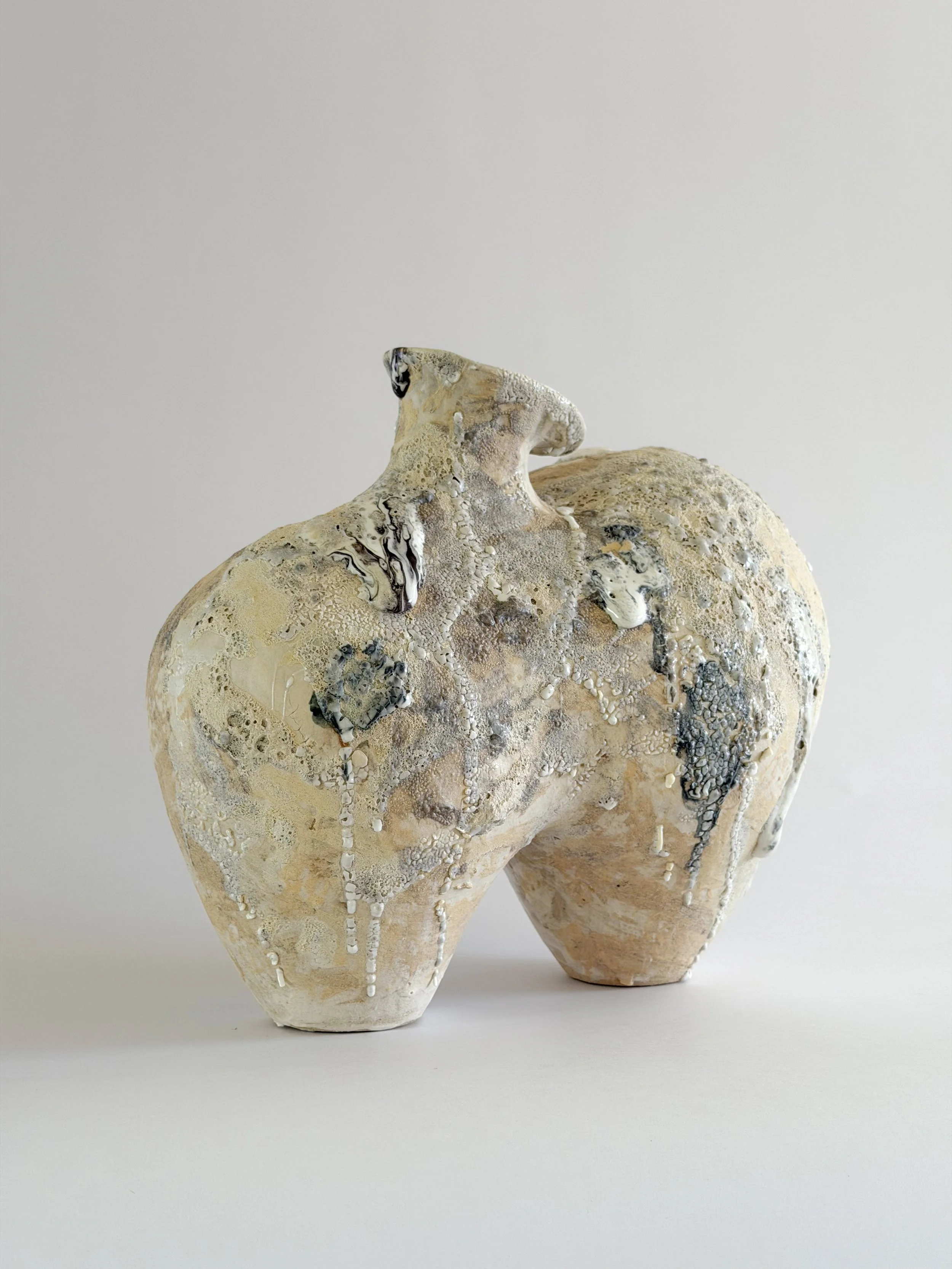 Form No. 1, with two full volumes resting under a crawling, sand-colored mineral crust — sculptural ceramic vase sculptural decor for