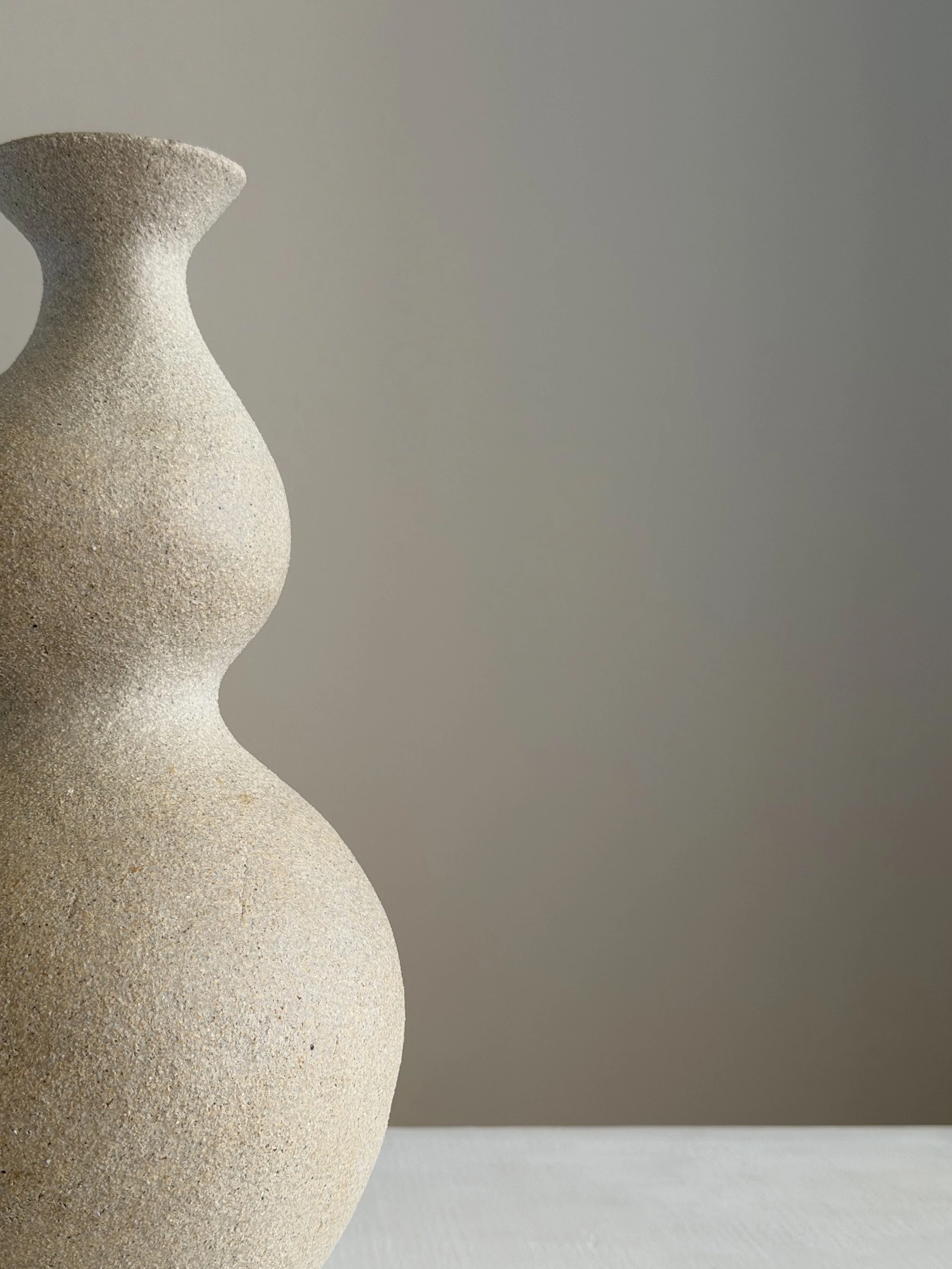 She 4: in the form of a woman with a full belly and soft hips shaped from clay, a sculptural ceramic vase by Anastasia Babenko