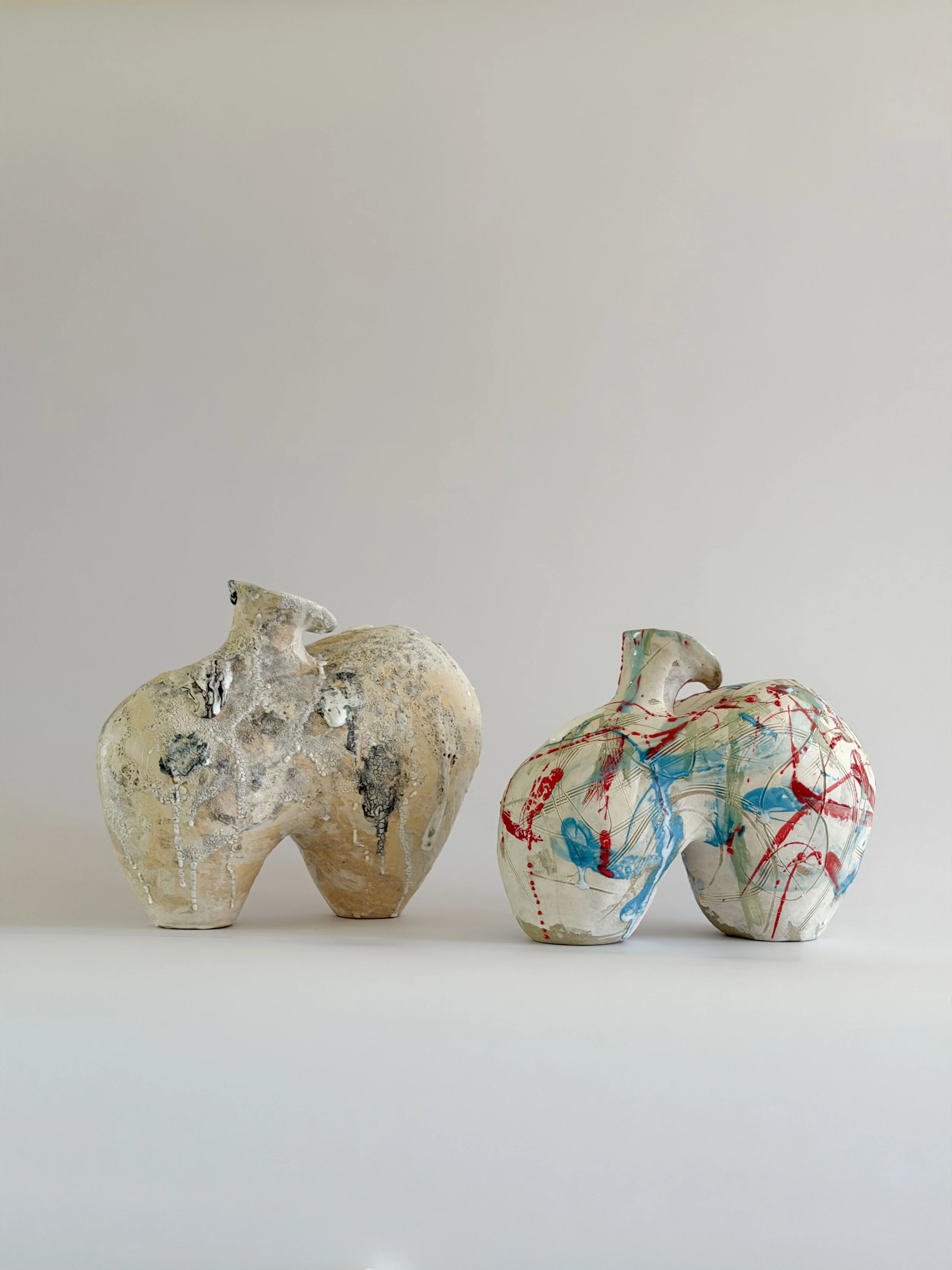 Form No. 2 by Anastasia Babenko — with runny white glaze over red, turquoise and green and fine incised lines, made for considered, organic