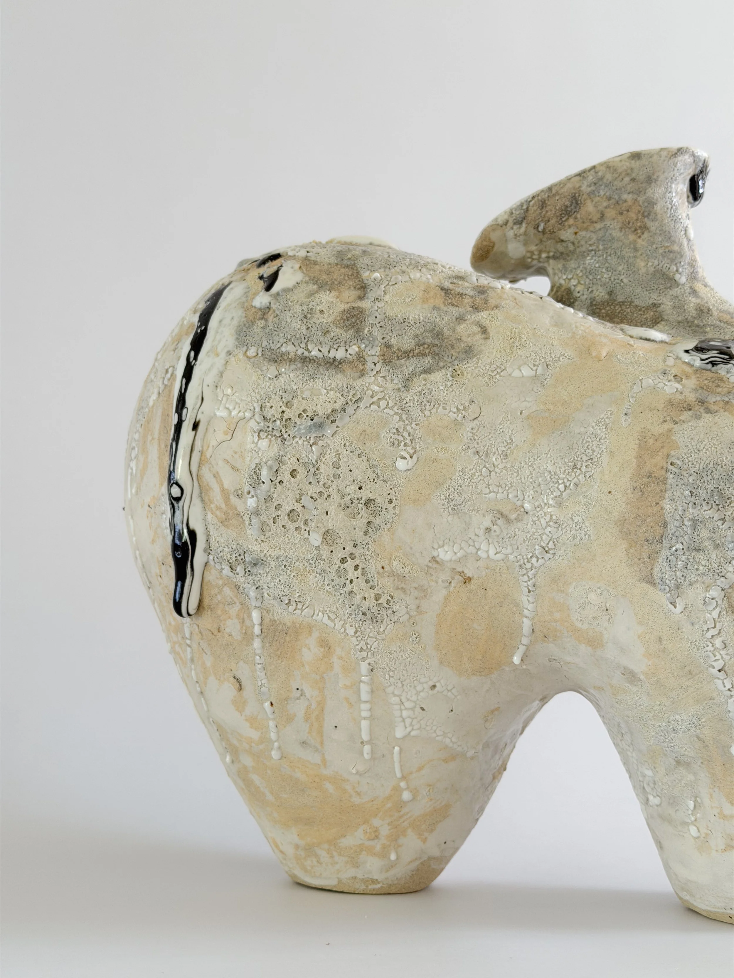 Form No. 1, with two full volumes resting under a crawling, sand-colored mineral crust — sculptural ceramic vase made for considered, organic