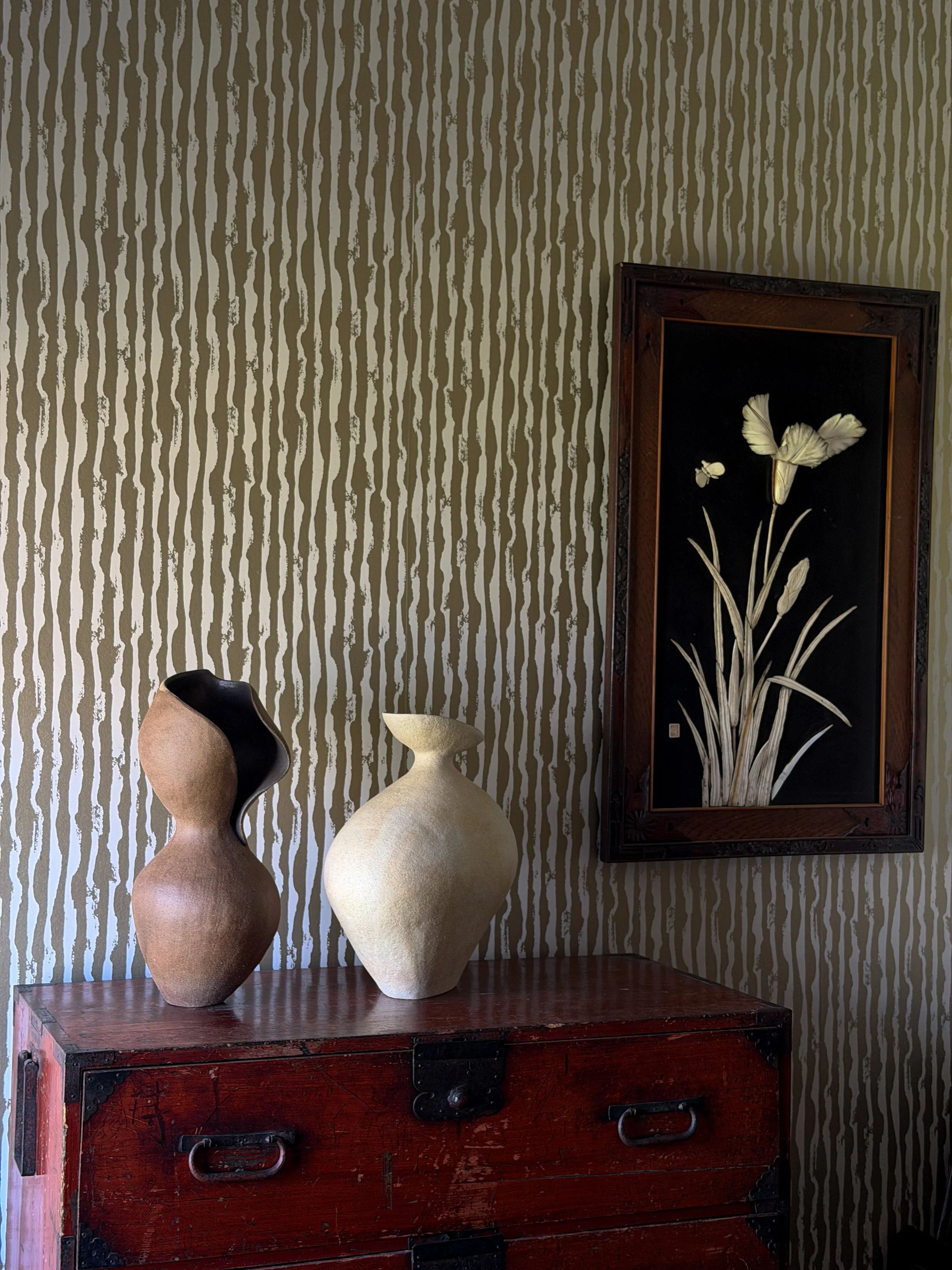 Two hand-built ceramic vases by Anastasia Babenko on an antique tansu chest at Erica Tanov Atelier