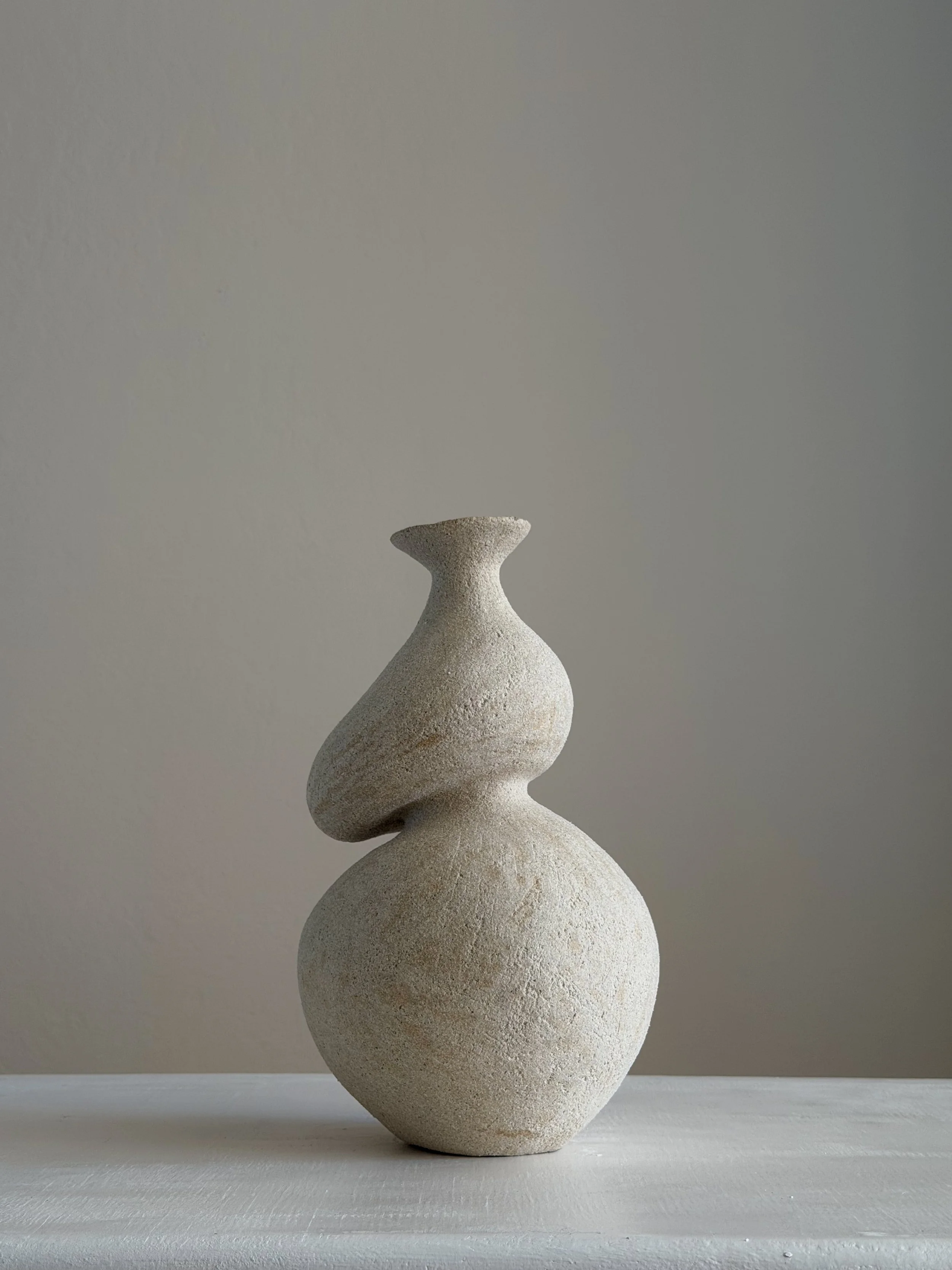 Hand-built ceramic vase: She 5, in the form of a woman caught mid-turn, tilting toward a slender neck — Anastasia Babenko