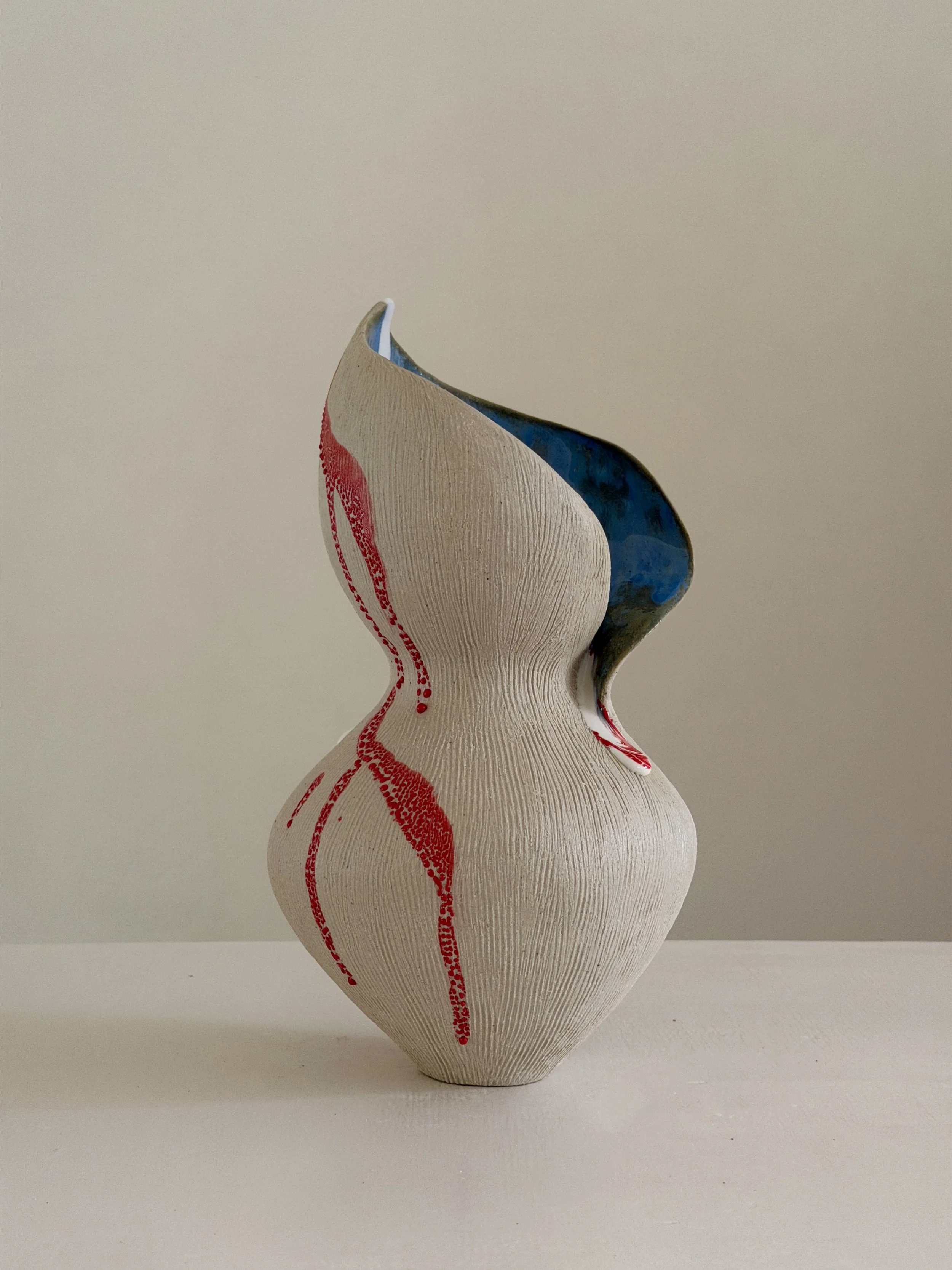 She 6, in the form of a resting woman, soft and full — sculptural ceramic vase sculptural decor for design-led spaces