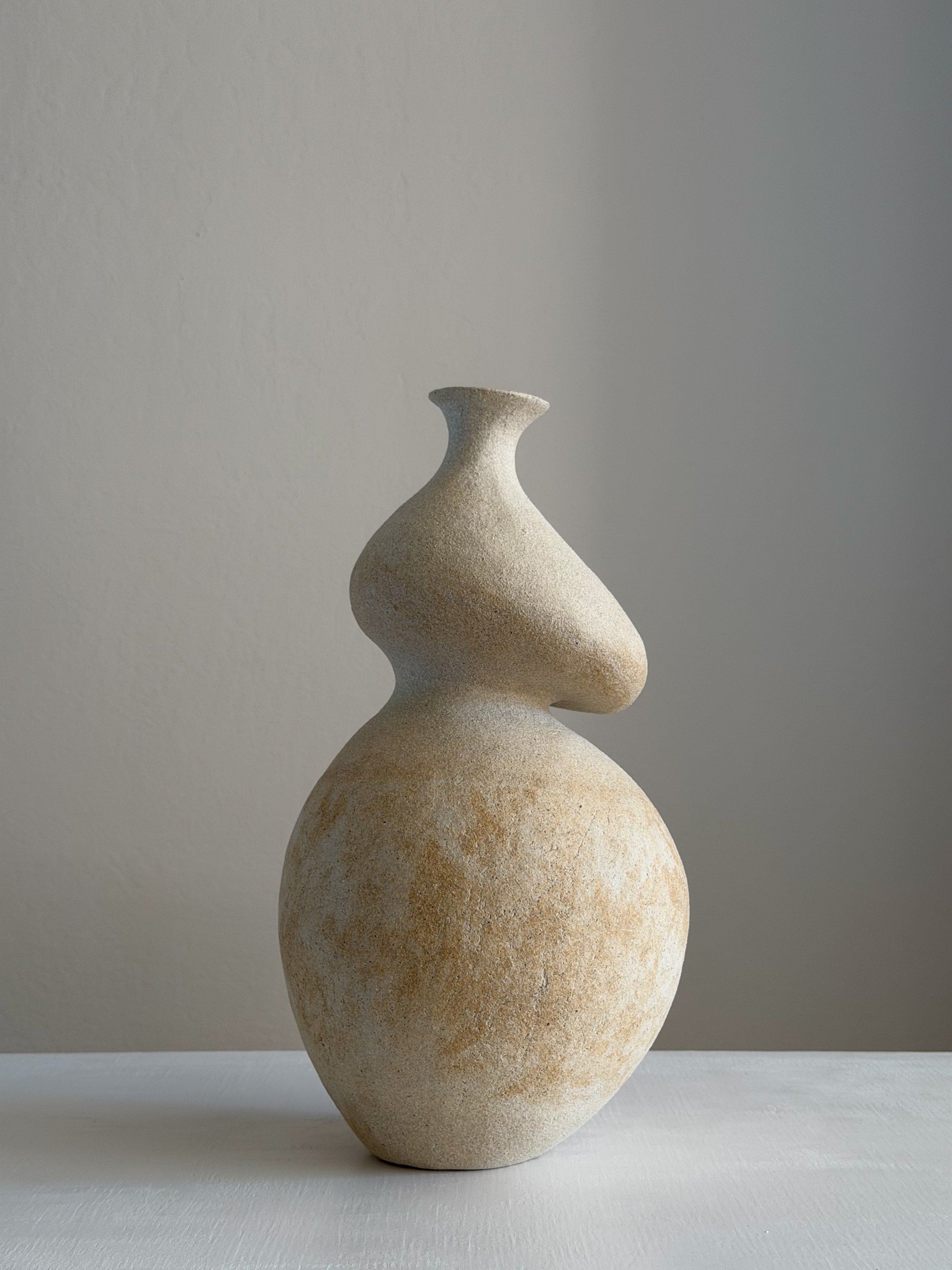 She 3: in the form of a resting woman with a full, round belly and soft upper body, a sculptural ceramic vase by Anastasia Babenko