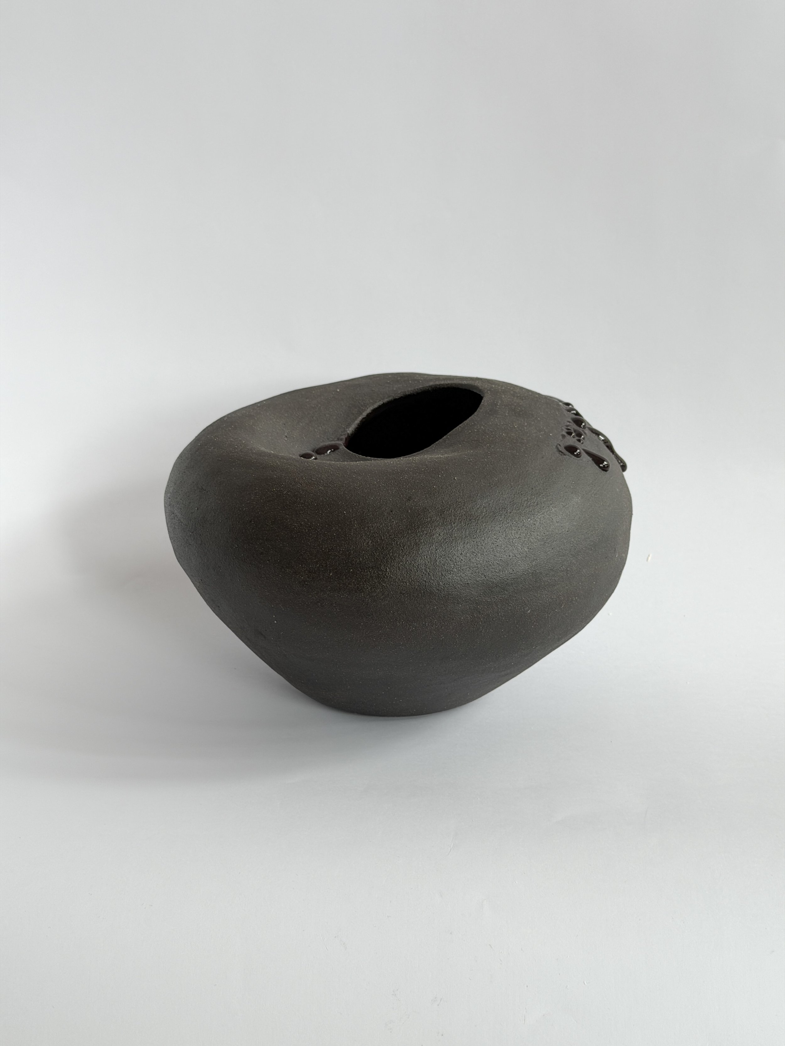 Whispering Stone — hand-built ceramic vase shaped like a smooth river stone, organic and calming, by Anastasia Babenko