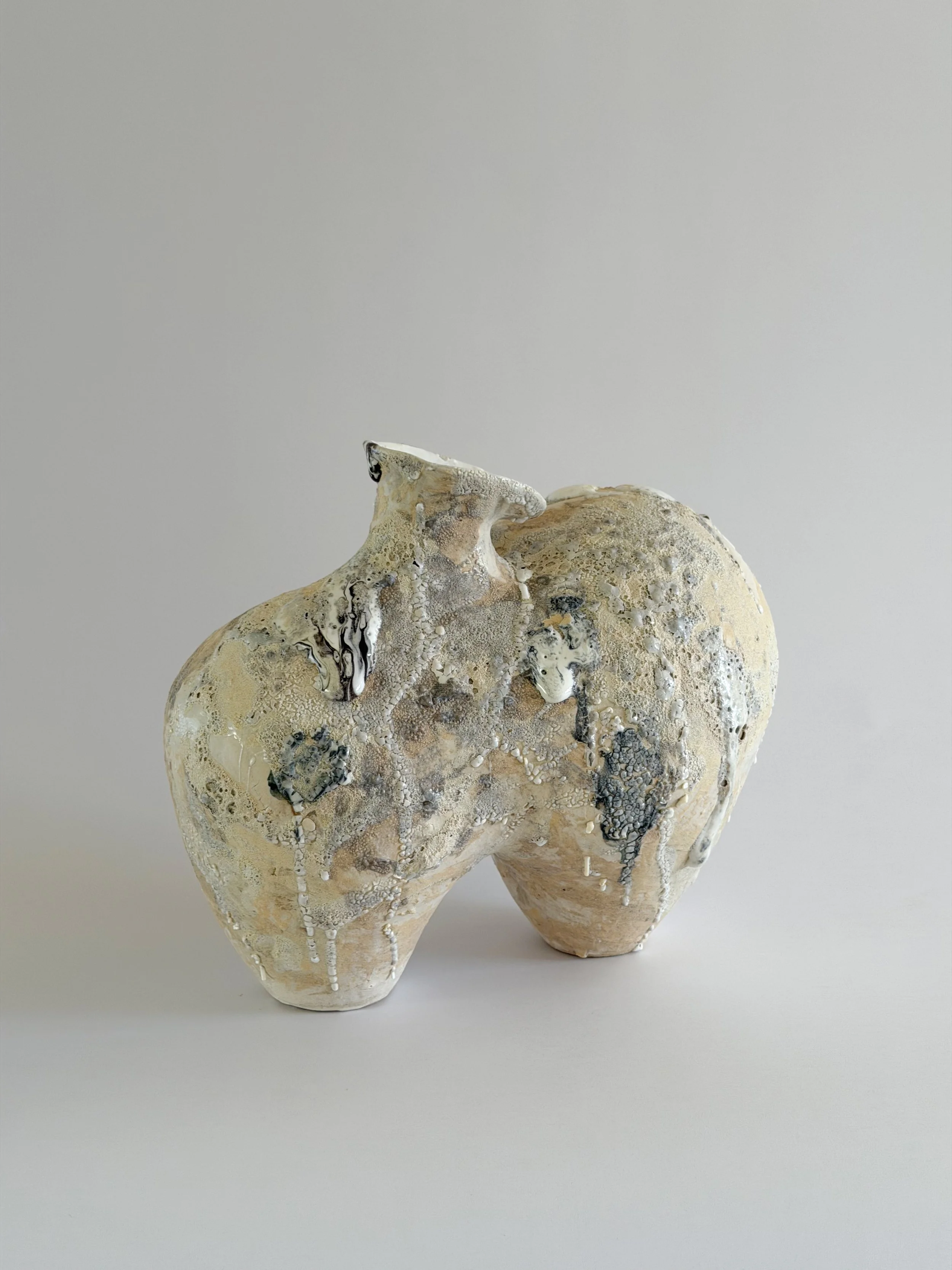 Hand-built ceramic vase: Form No. 1, with two full volumes resting under a crawling, sand-colored mineral crust — Anastasia Babenko