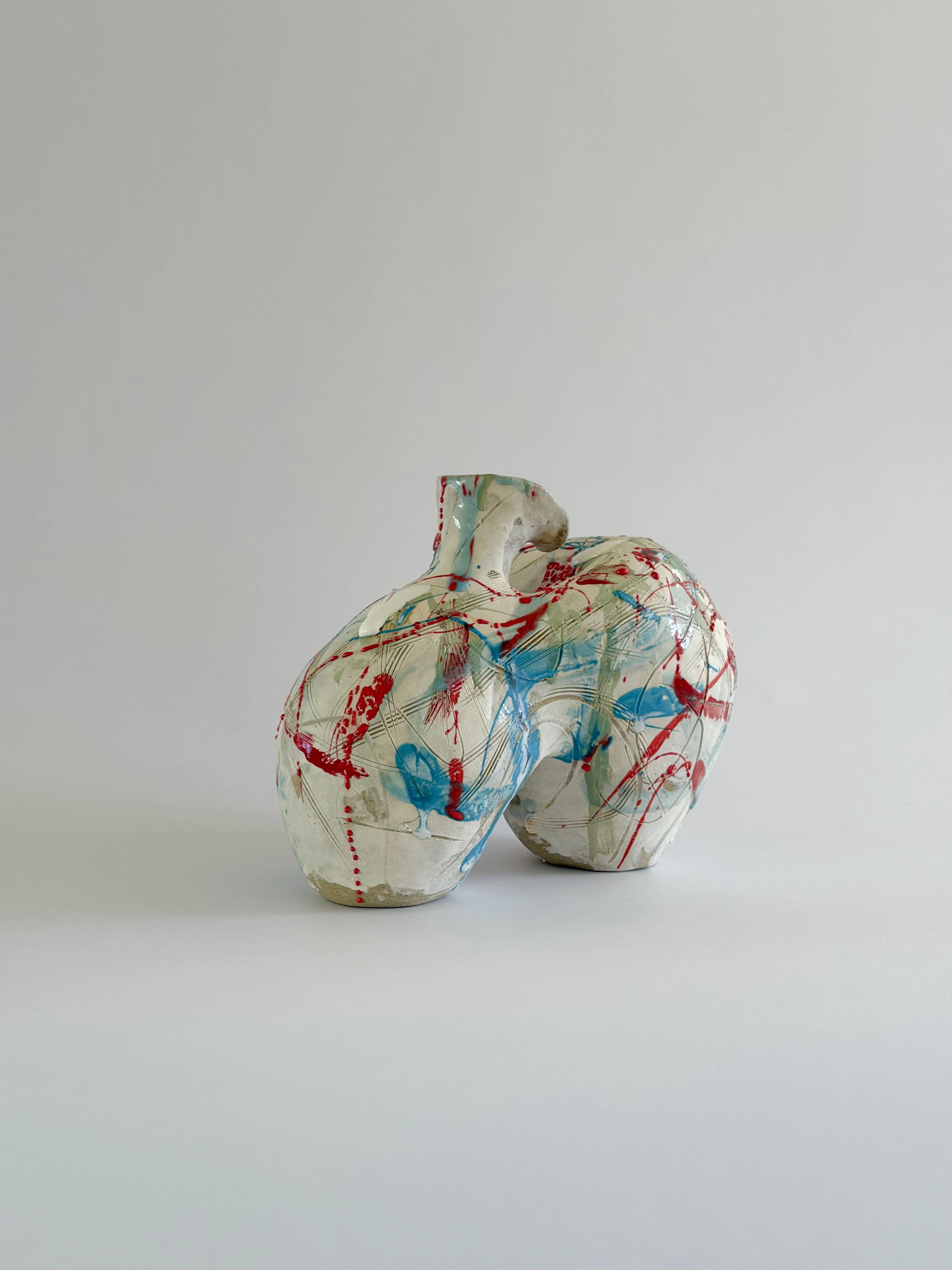 Form No. 2 — hand-built ceramic vase with runny white glaze over red, turquoise and green and fine incised lines, by Anastasia Babenko