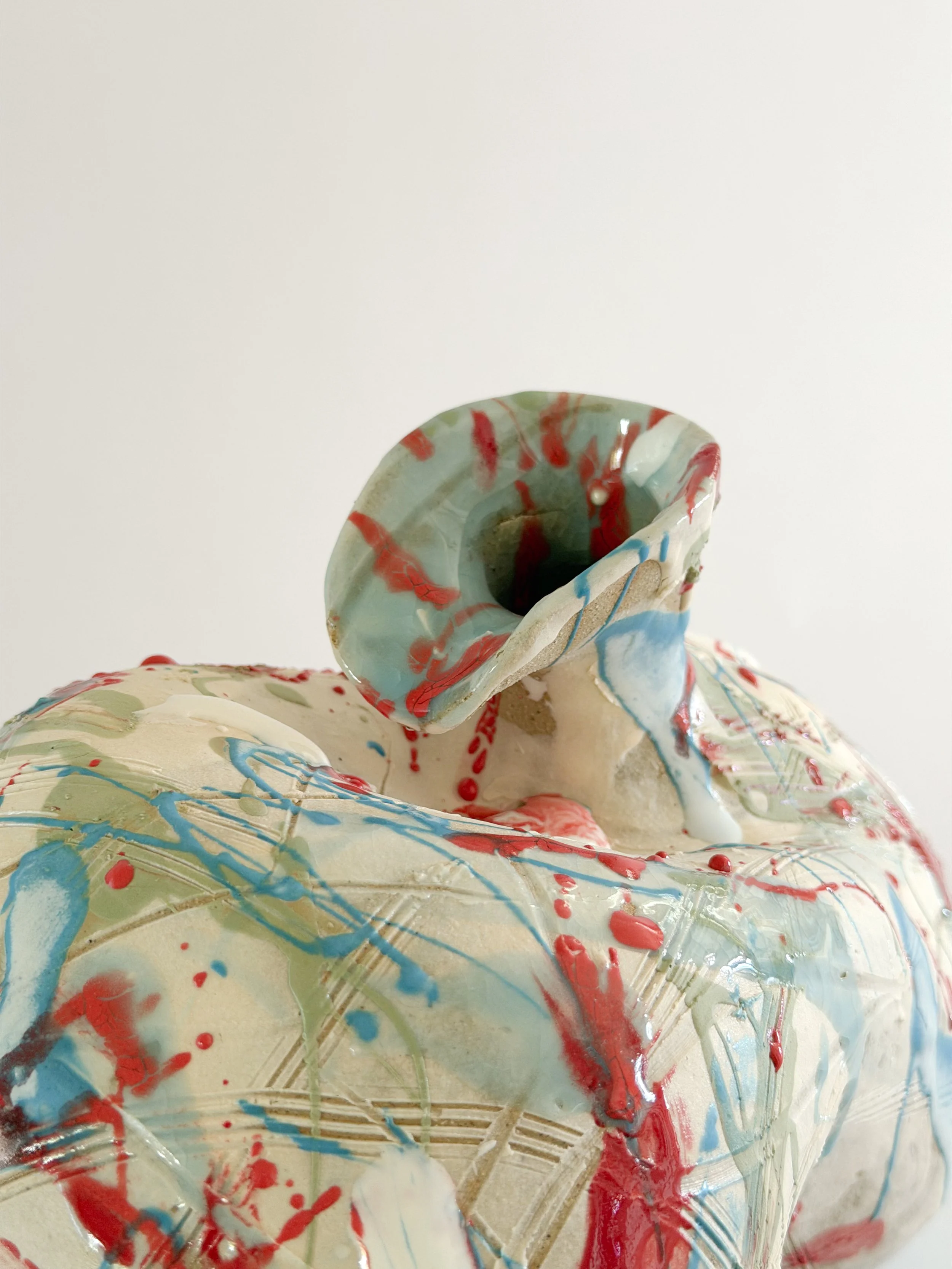 Form No. 2: with runny white glaze over red, turquoise and green and fine incised lines, a sculptural ceramic vase by Anastasia Babenko