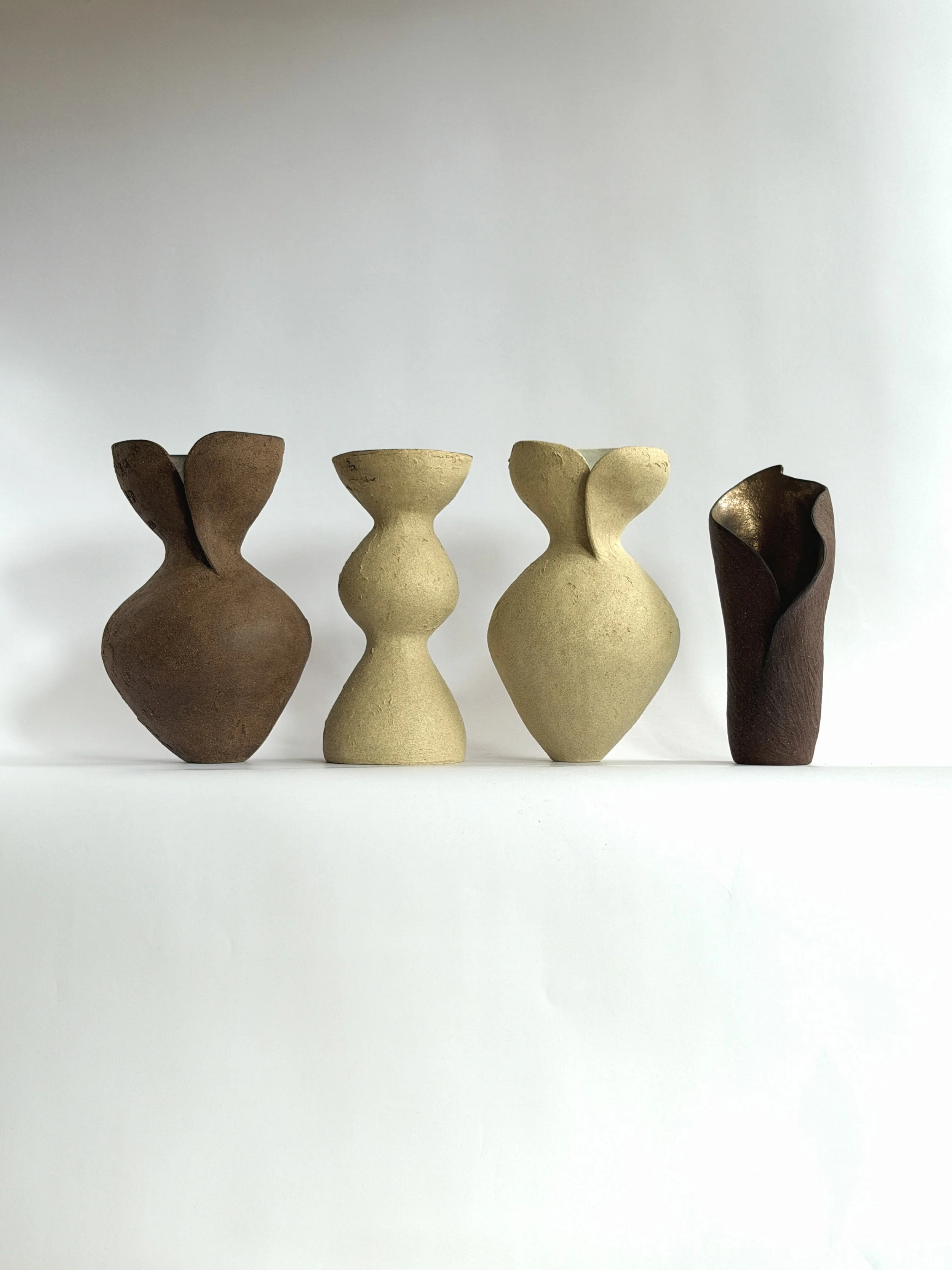 Silhouette Vase in Brown: tracing a woman's full, rounded silhouette in warm brown stoneware, a sculptural ceramic vase by Anastasia Babenko