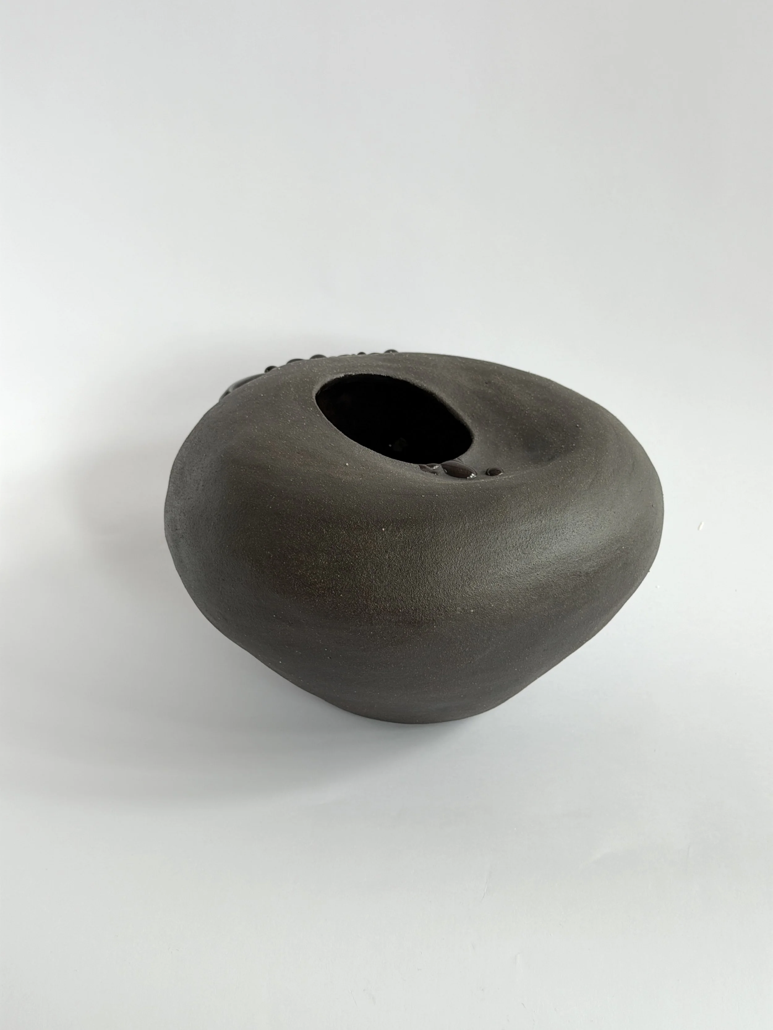Whispering Stone: shaped like a smooth river stone, organic and calming, a sculptural ceramic vase by Anastasia Babenko