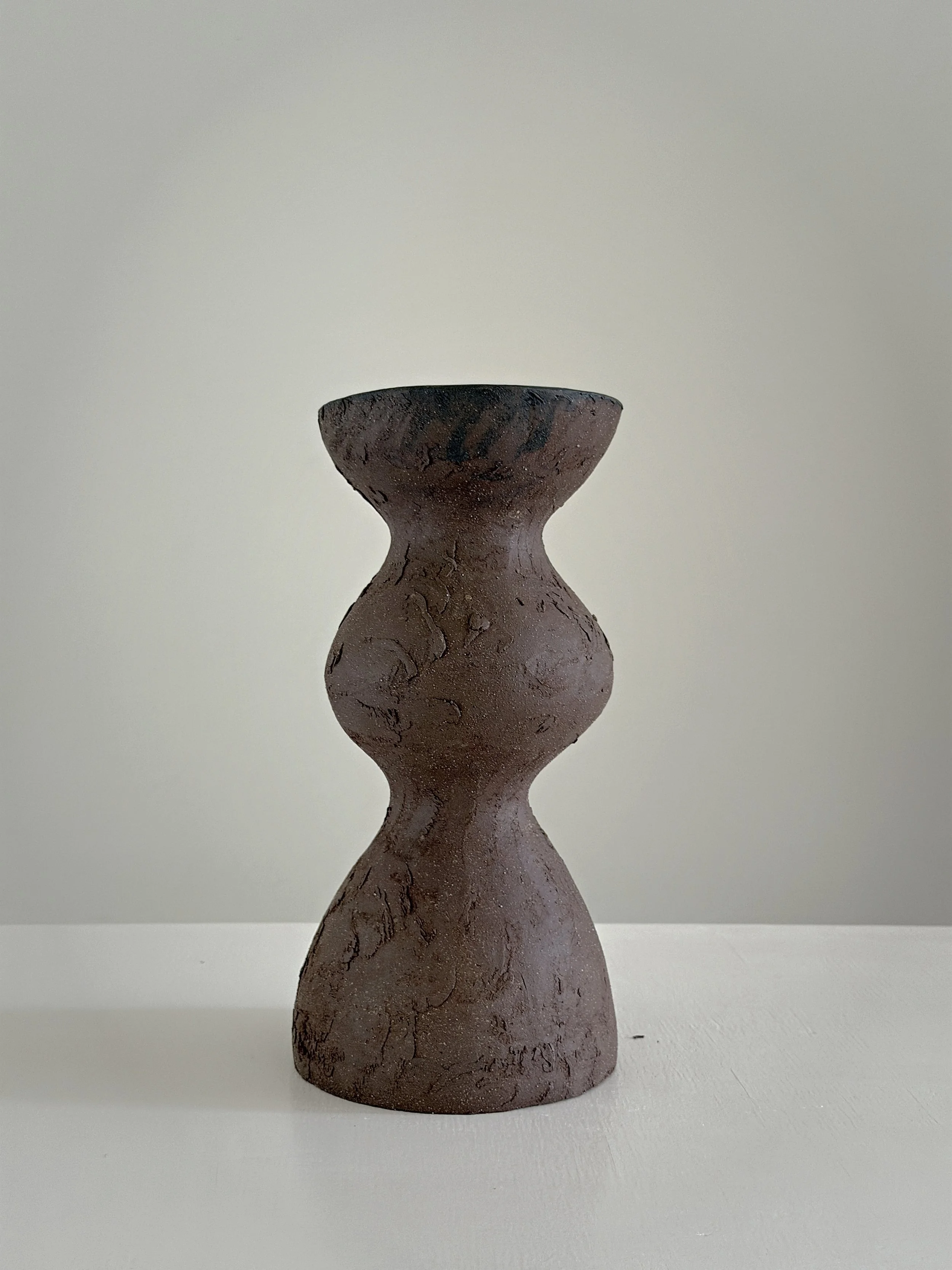 Dark Brown Totem Vase: with a brutalist, totem-like architectural silhouette in deep brown stoneware, a sculptural ceramic vase by Anastasia