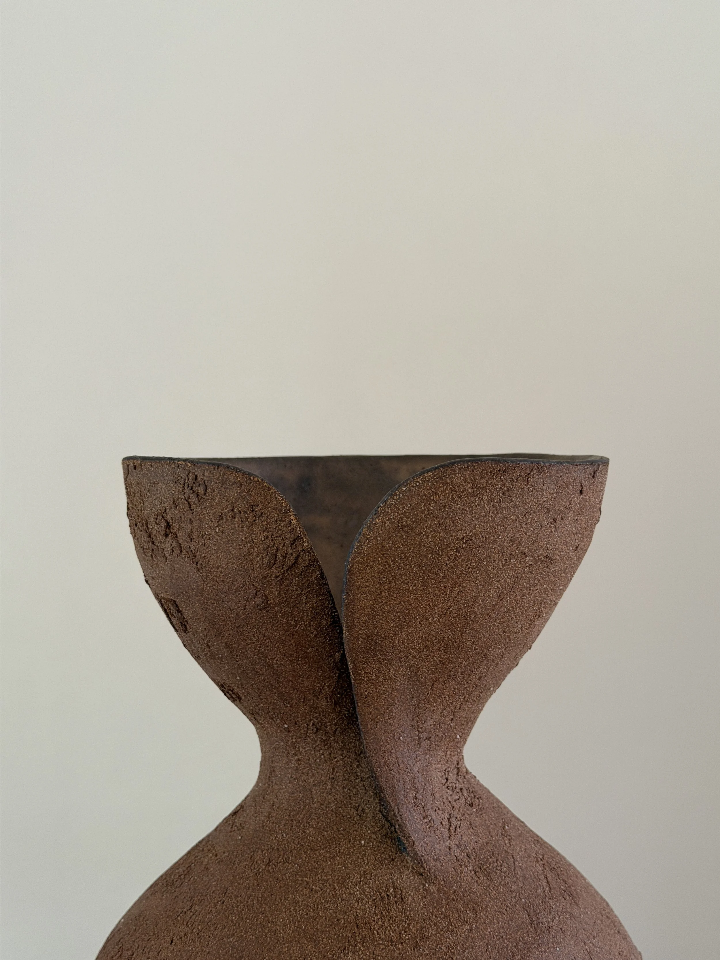 Silhouette Vase in Brown by Anastasia Babenko — tracing a woman's full, rounded silhouette in warm brown stoneware, original ceramic art for
