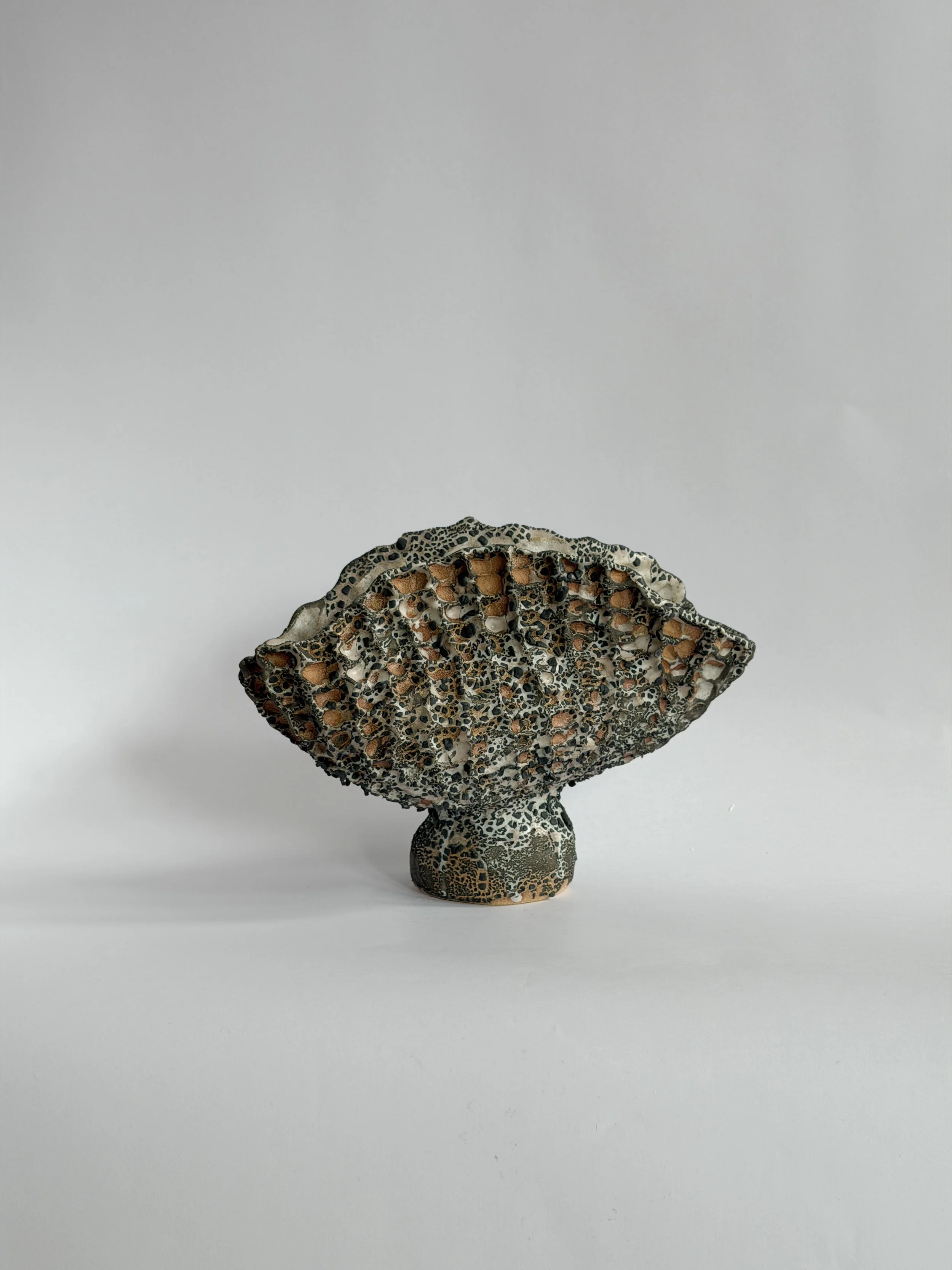 Coral Vase with Black — hand-built ceramic vase with a honeycomb, coral-like surface finished in black, by Anastasia Babenko