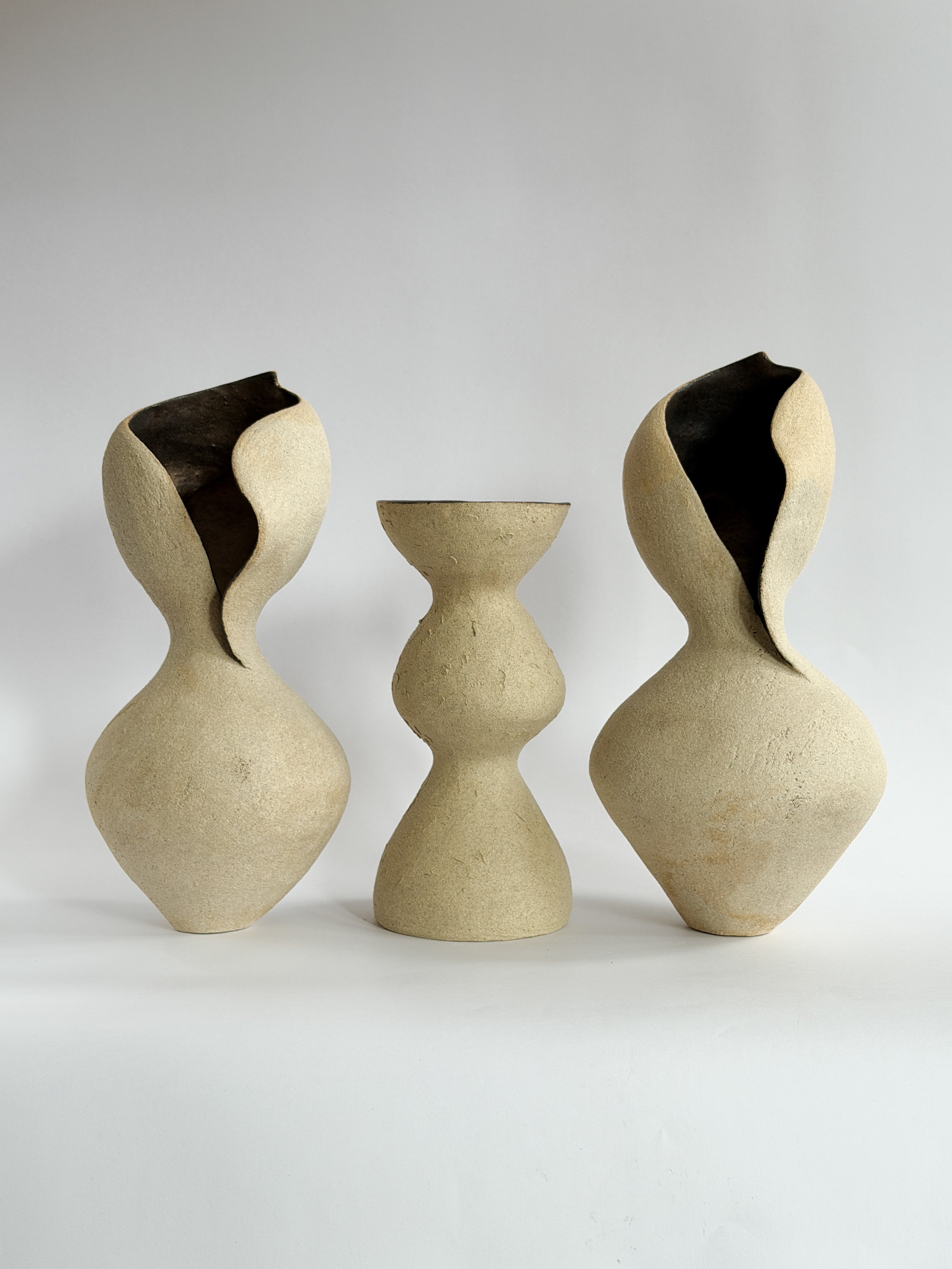 Beige Totem Vase — hand-built ceramic vase with a brutalist, totem-like silhouette in raw beige stoneware, by Anastasia Babenko