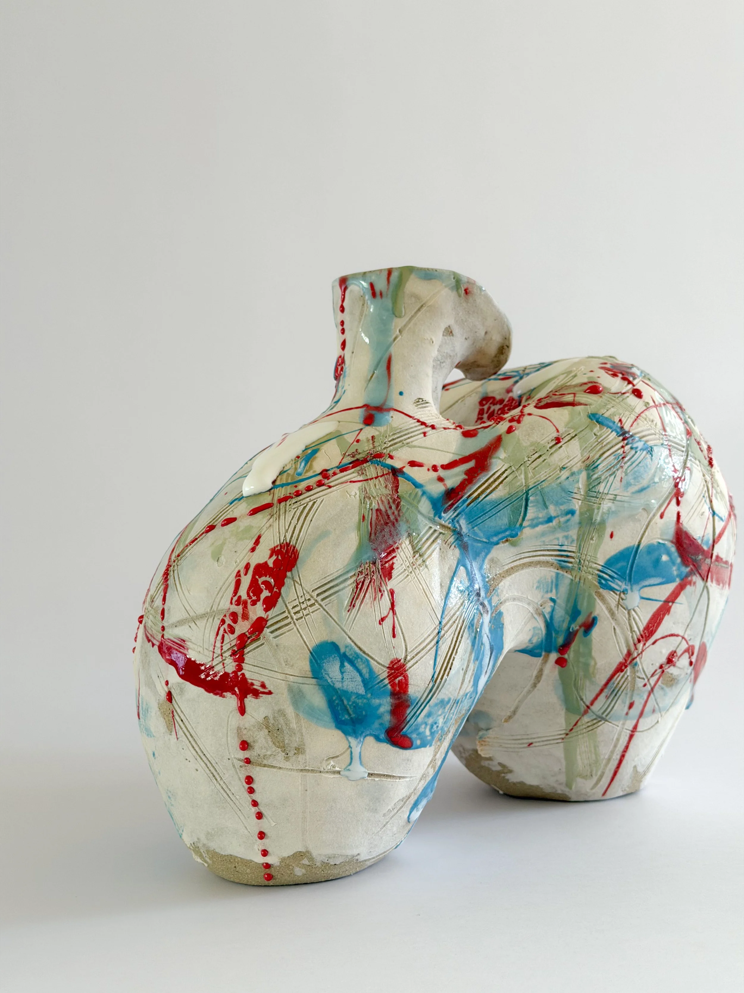 Form No. 2: with runny white glaze over red, turquoise and green and fine incised lines, a sculptural ceramic vase by Anastasia Babenko