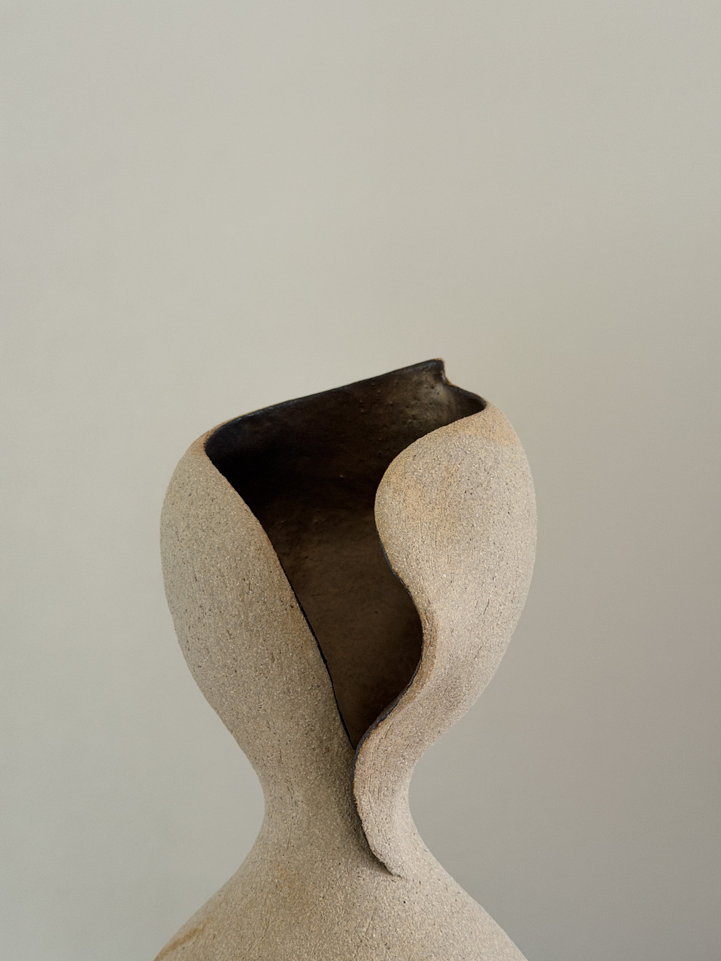 Woman 4, in the form of a woman at rest, soft and full, in warm beige stoneware — sculptural ceramic vase sculptural decor for design-led spaces