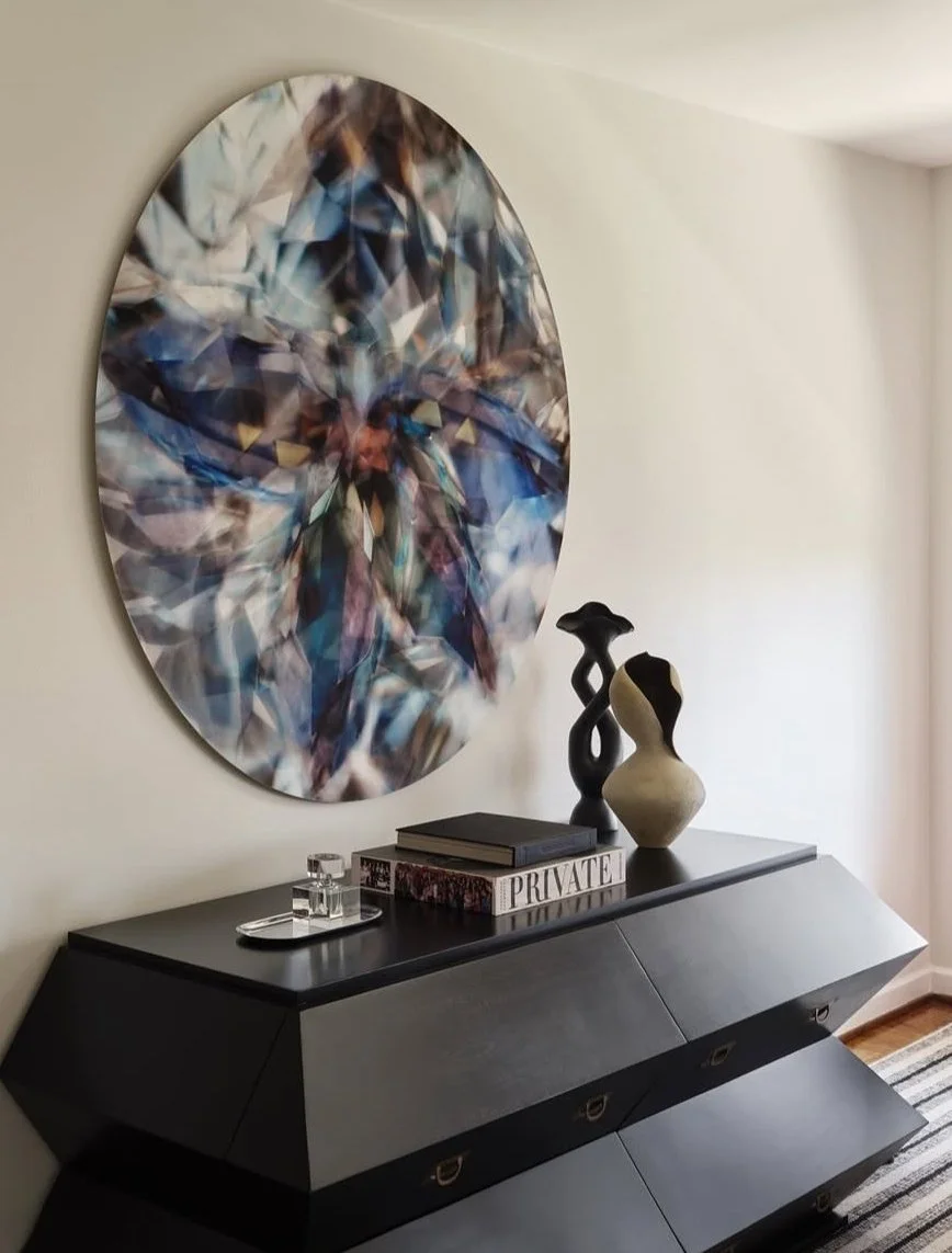 Sculptural ceramic vase by Anastasia Babenko on a black sideboard, interior by Ricki Stevens Design