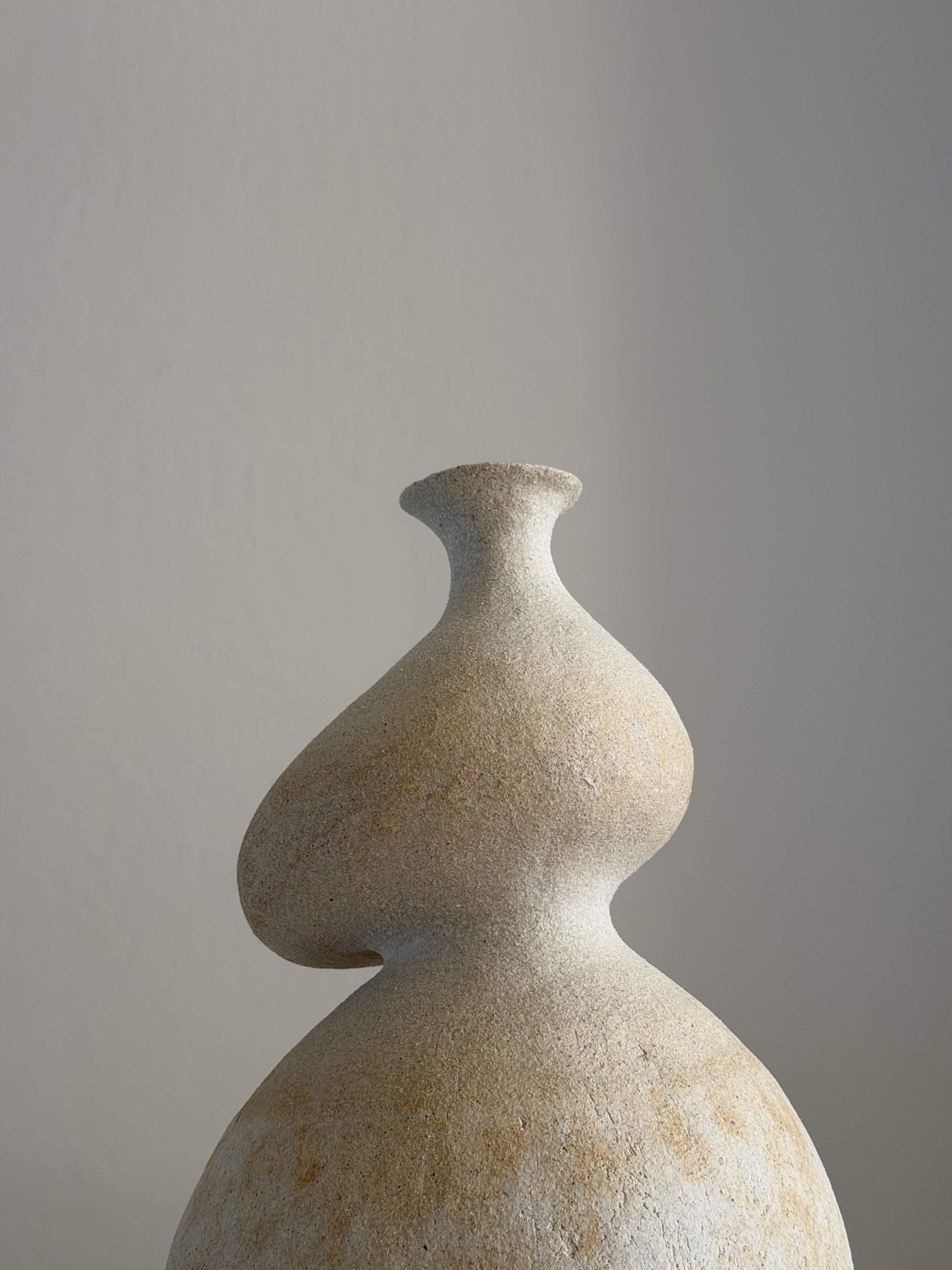 She 3, in the form of a resting woman with a full, round belly and soft upper body — sculptural ceramic vase sculptural decor for design-led