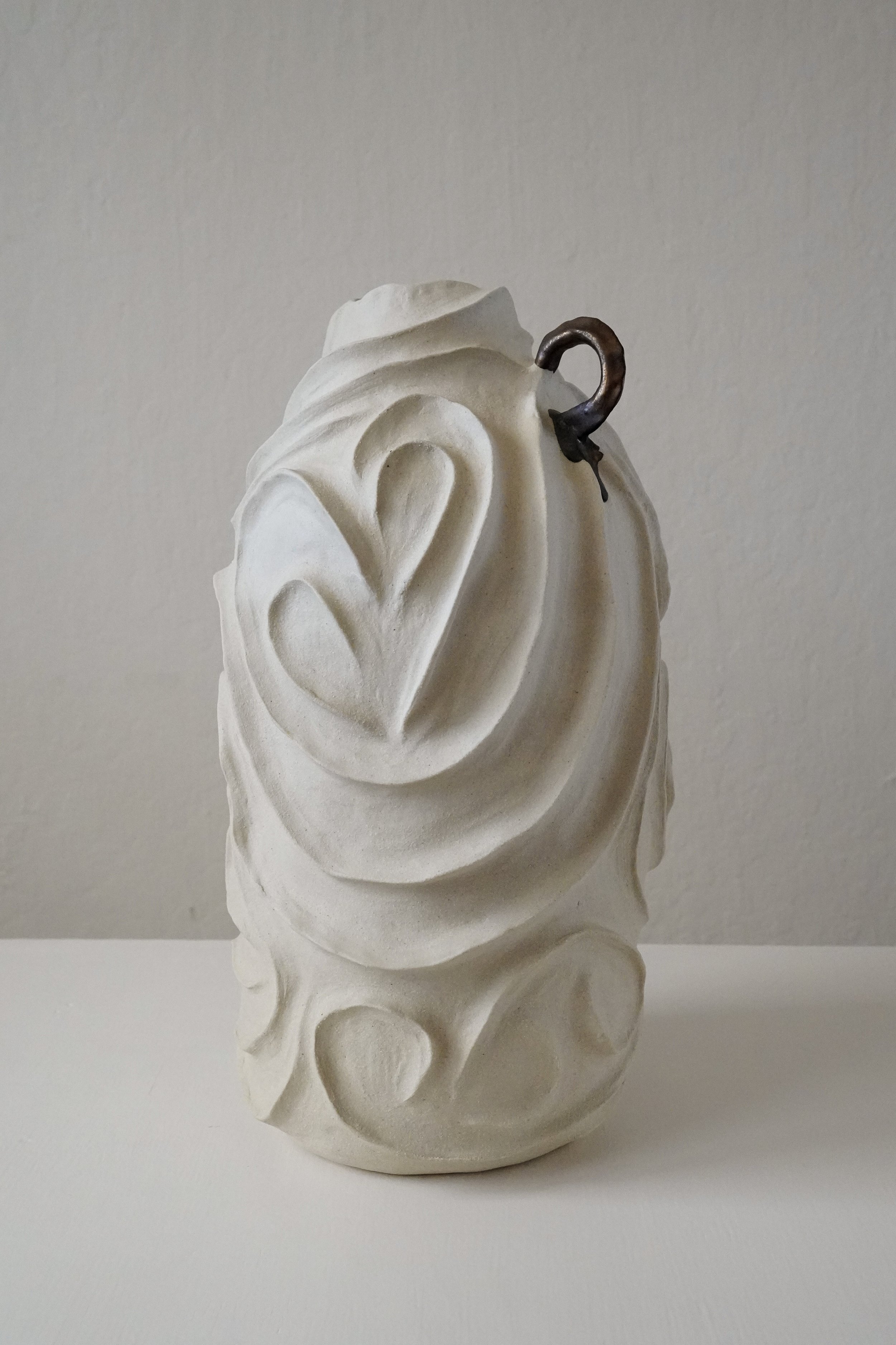Alabaster No. 1: carved all over with flowing, swirling relief in pale matte stoneware, a sculptural ceramic vase by Anastasia Babenko