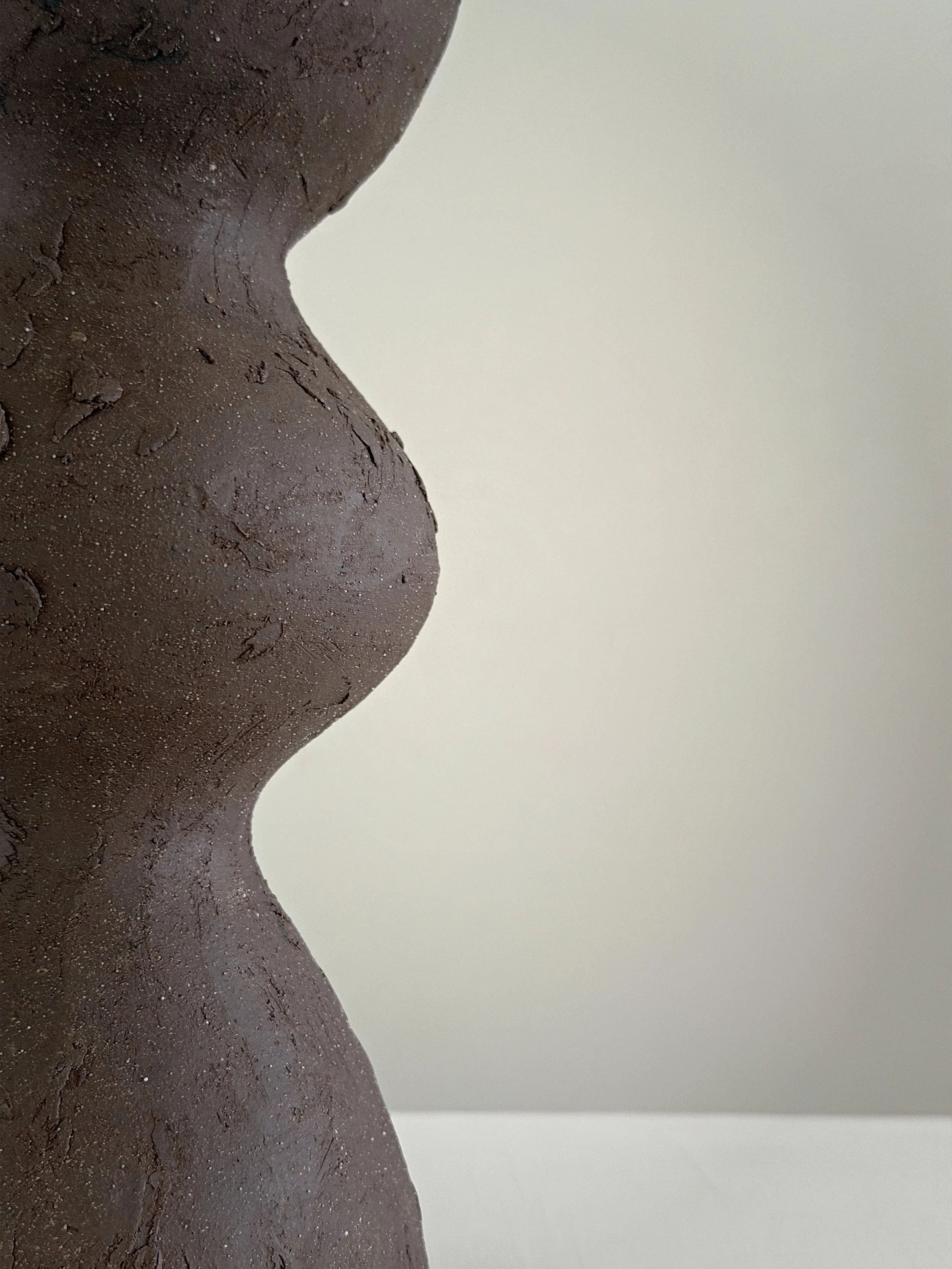 Hand-built ceramic vase: Dark Brown Totem Vase, with a brutalist, totem-like architectural silhouette in deep brown stoneware — Anastasia Babenko