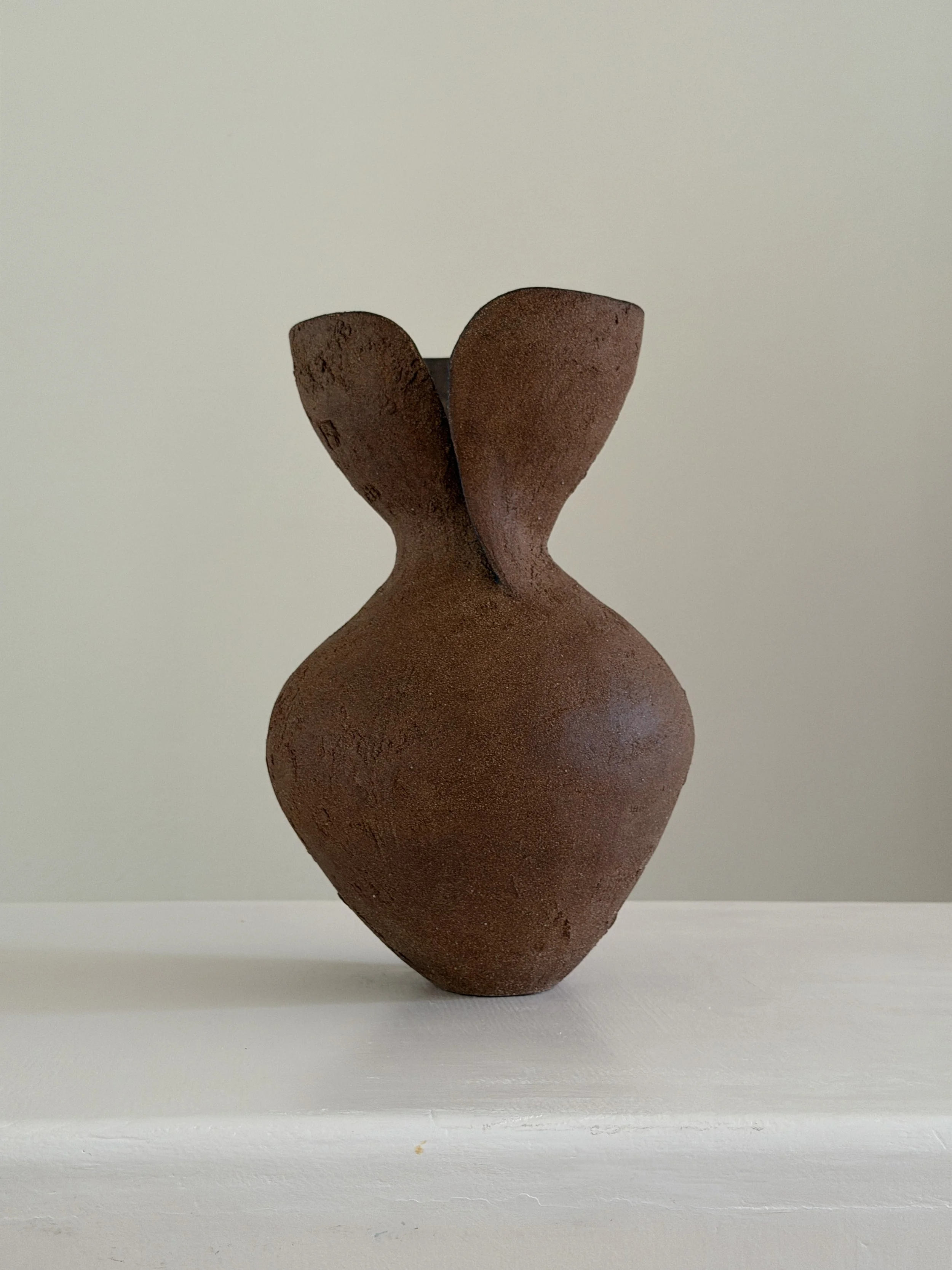 Silhouette Vase in Brown — hand-built ceramic vase tracing a woman's full, rounded silhouette in warm brown stoneware, by Anastasia Babenko