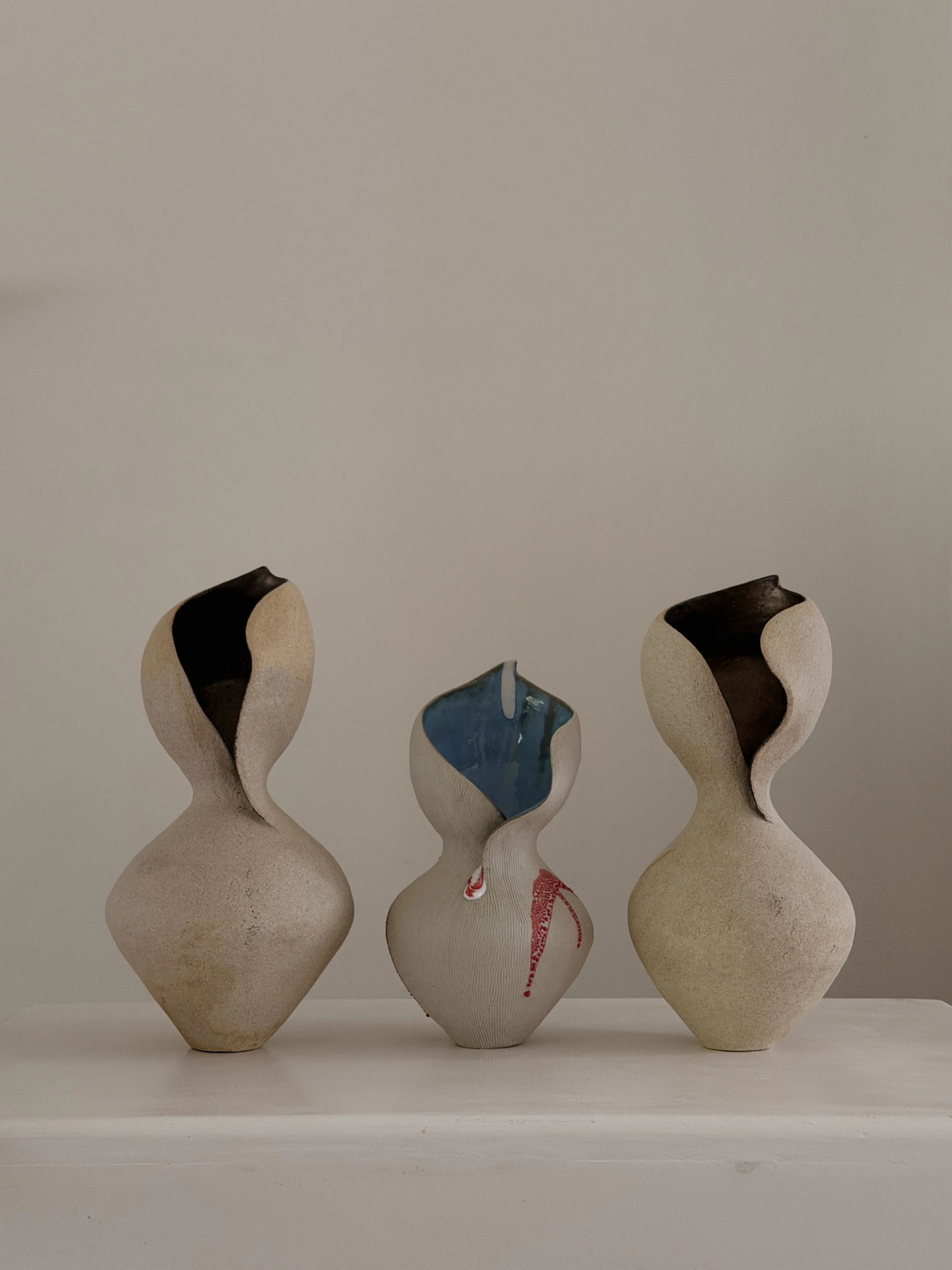 Woman 4, in the form of a woman at rest, soft and full, in warm beige stoneware — sculptural ceramic vase a contemporary stoneware accent piece