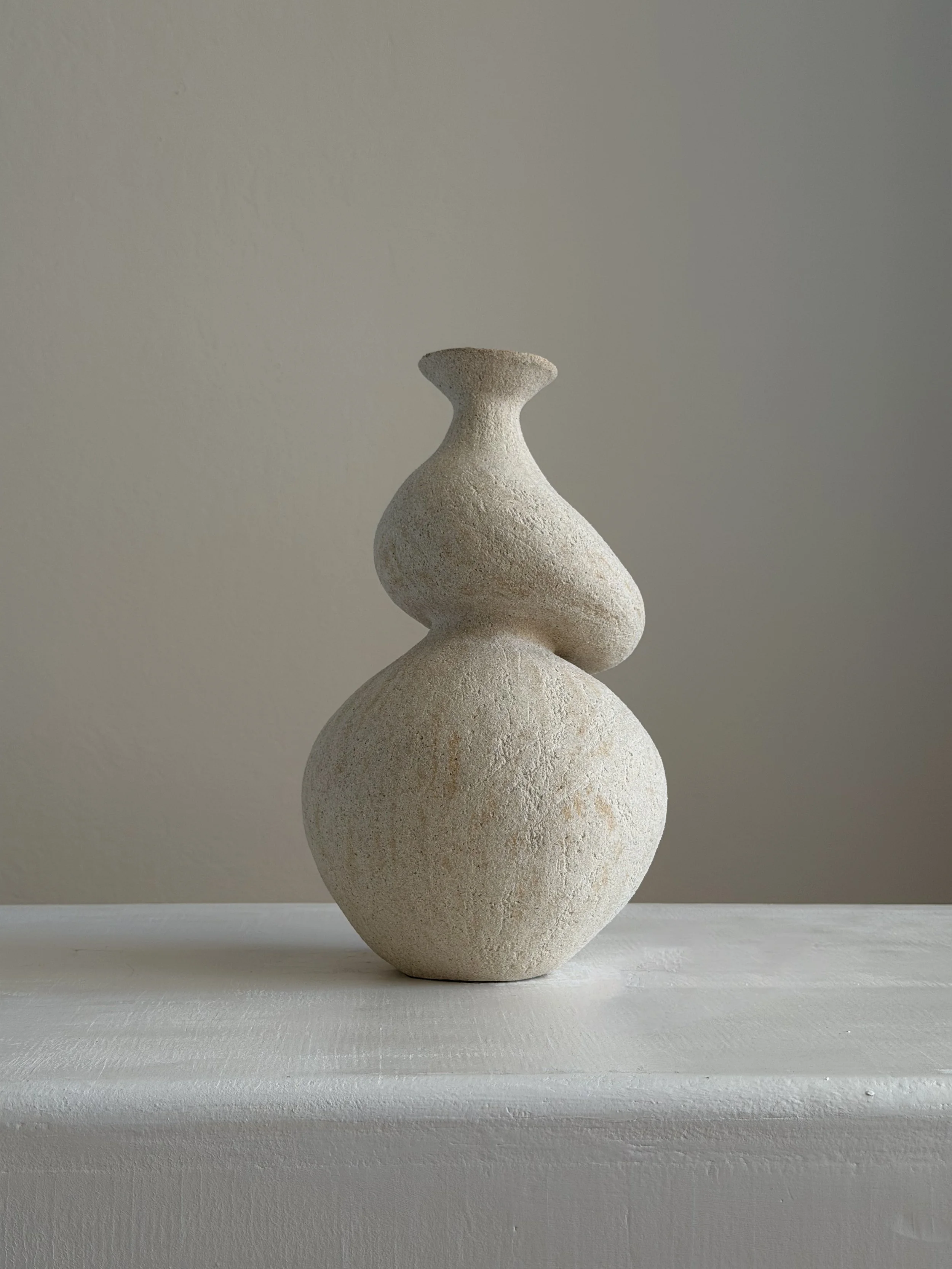 She 5: in the form of a woman caught mid-turn, tilting toward a slender neck, a sculptural ceramic vase by Anastasia Babenko