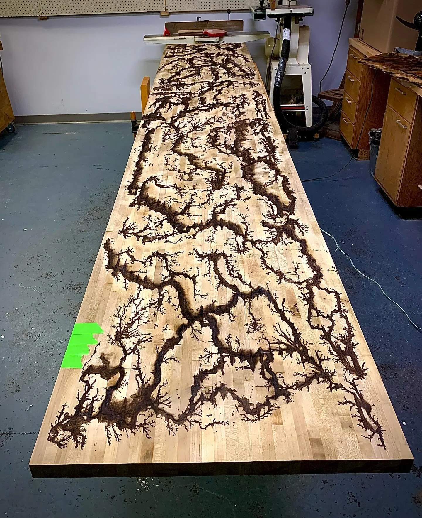 Working on this 12 foot computer table at the Monkeys Wrench! #fractal #fractalart #fractalwoodburning #wood #woodworker #woodworking #woodwork #woodworkcraft #woodbridge #woodburningart #epoxy #epoxyrivertable #rivertable