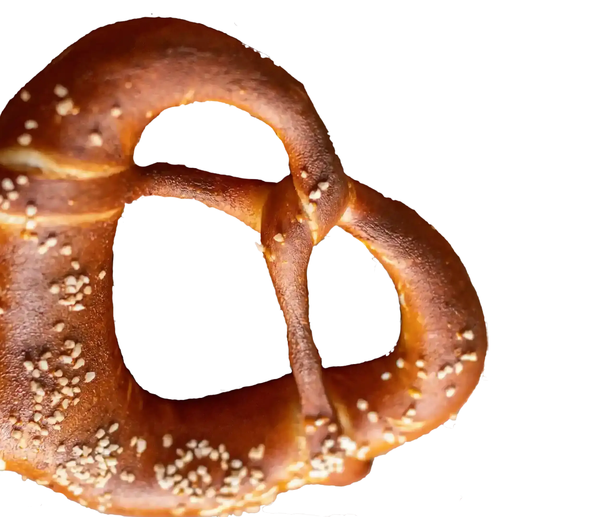 Close-up of a soft pretzel with a golden-brown crust and coarse salt topping.