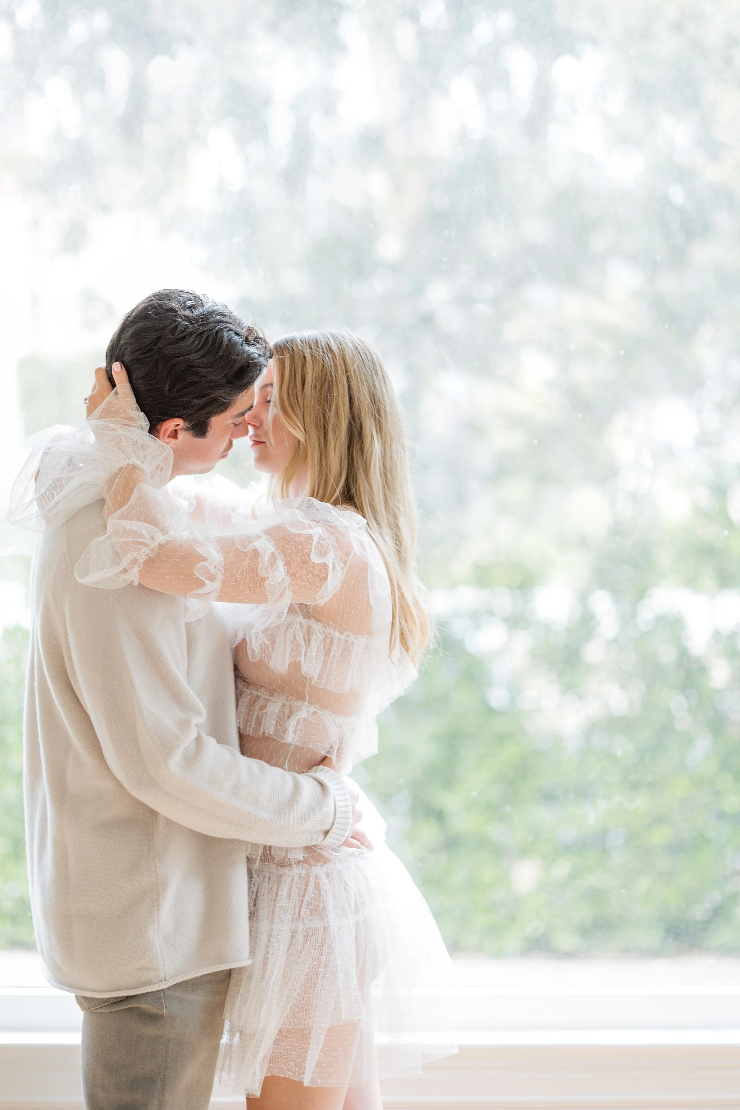 Romantic candid moment between engaged couple during Houston portrait session