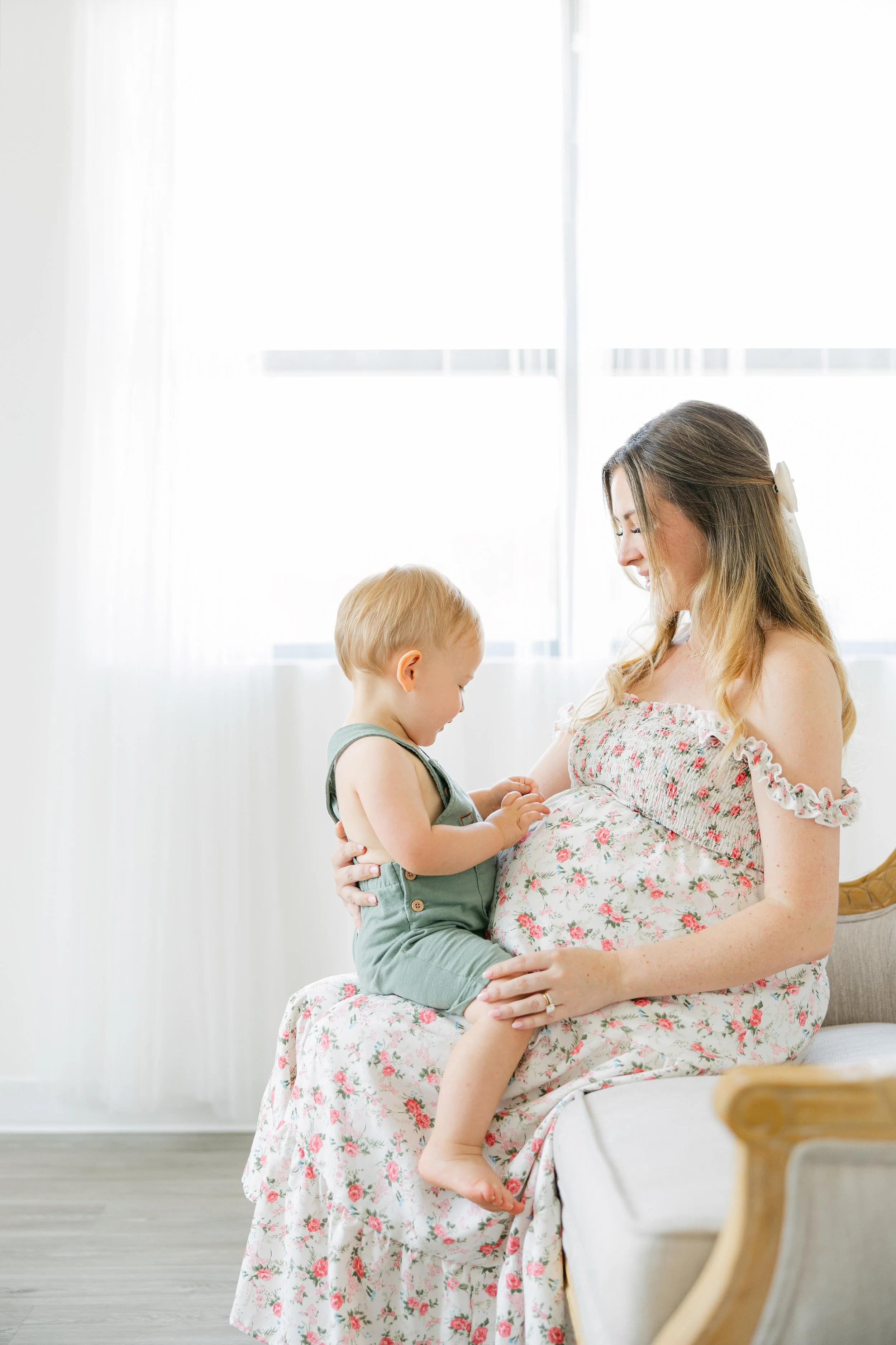 Mother and toddler laughing together during Houston portrait session