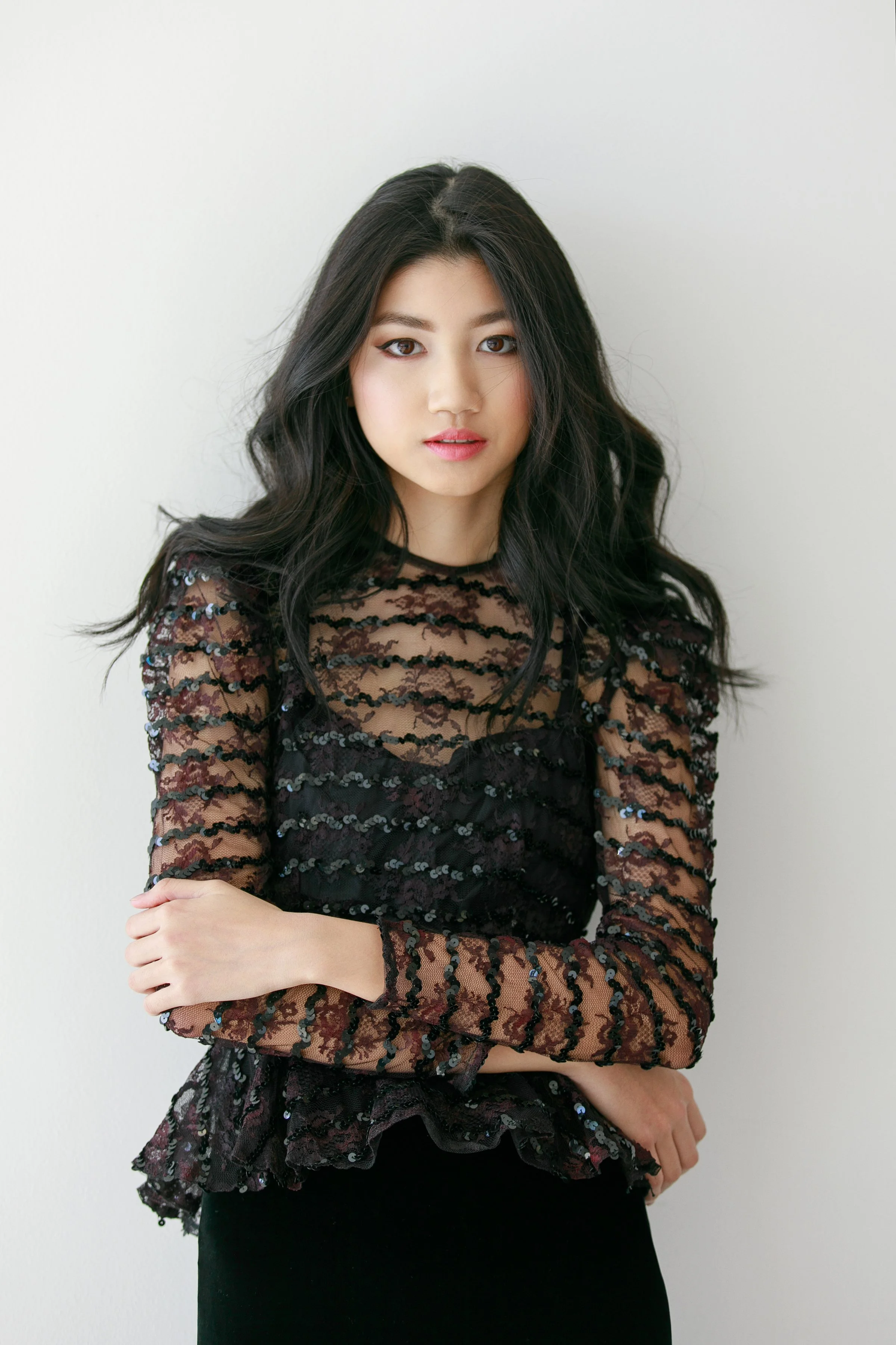 a women standing with her arms crossed