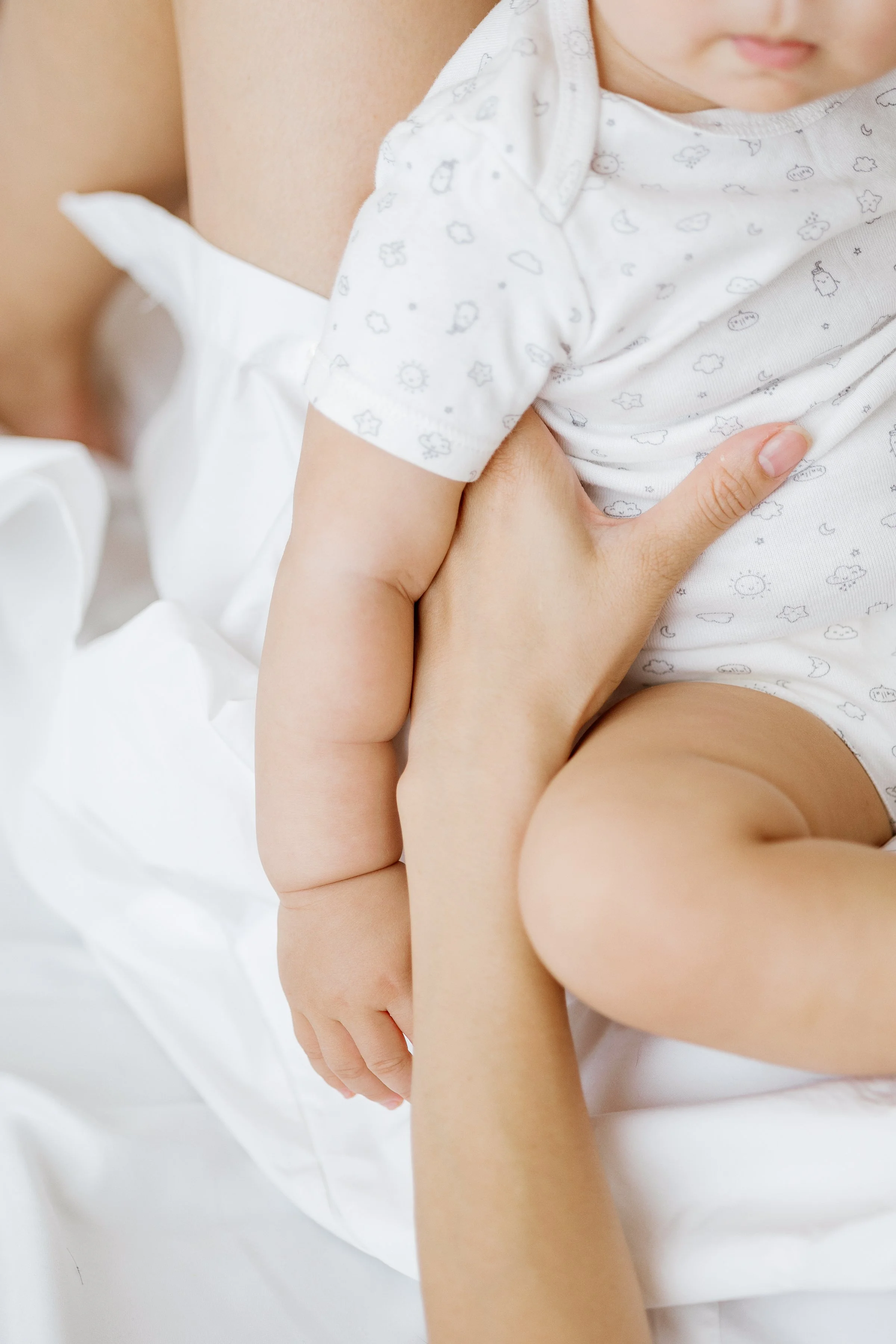 Mother gently holding child during Houston motherhood photography session