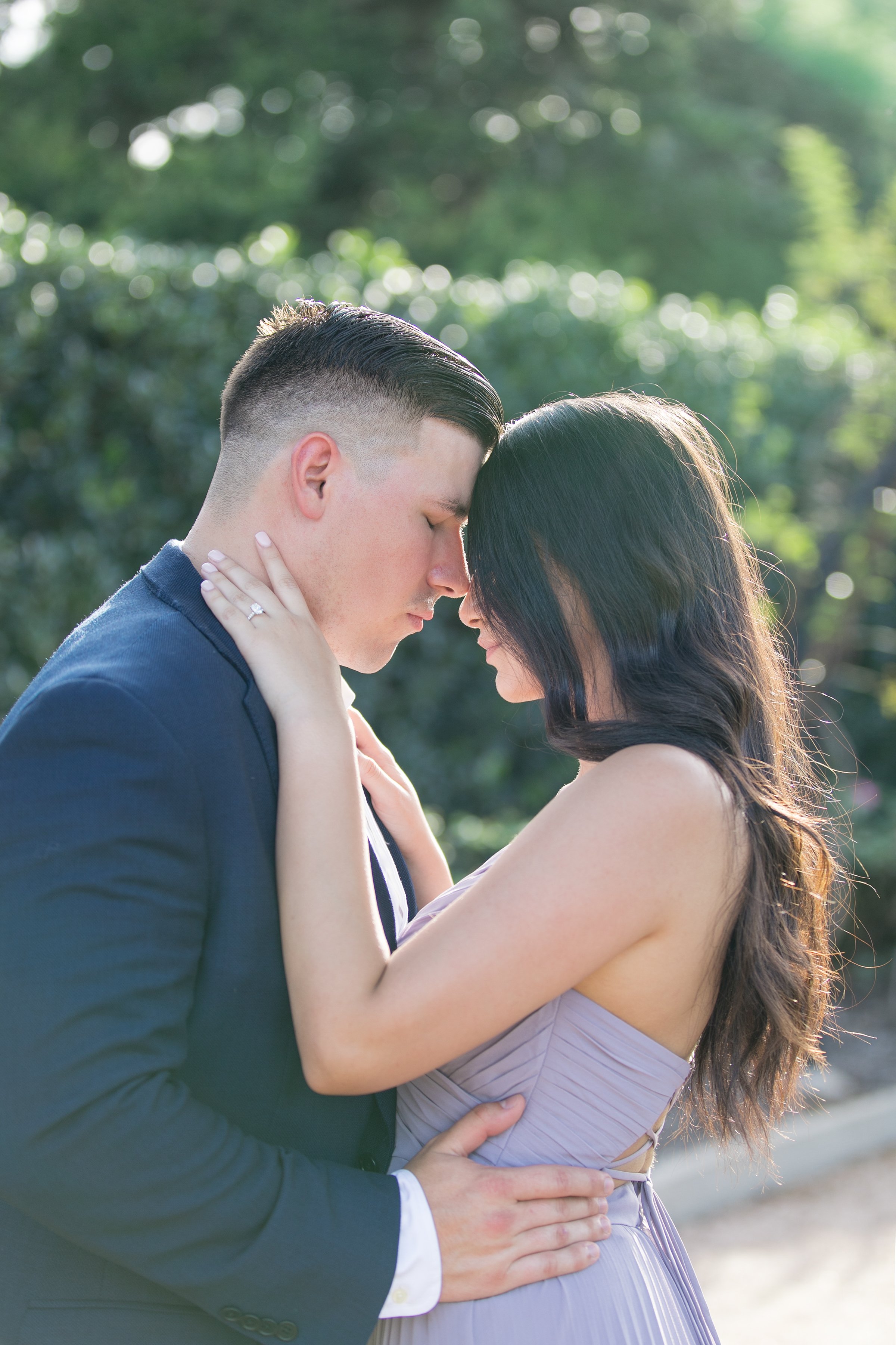 Romantic engagement portrait of couple embracing during Houston engagement photography session