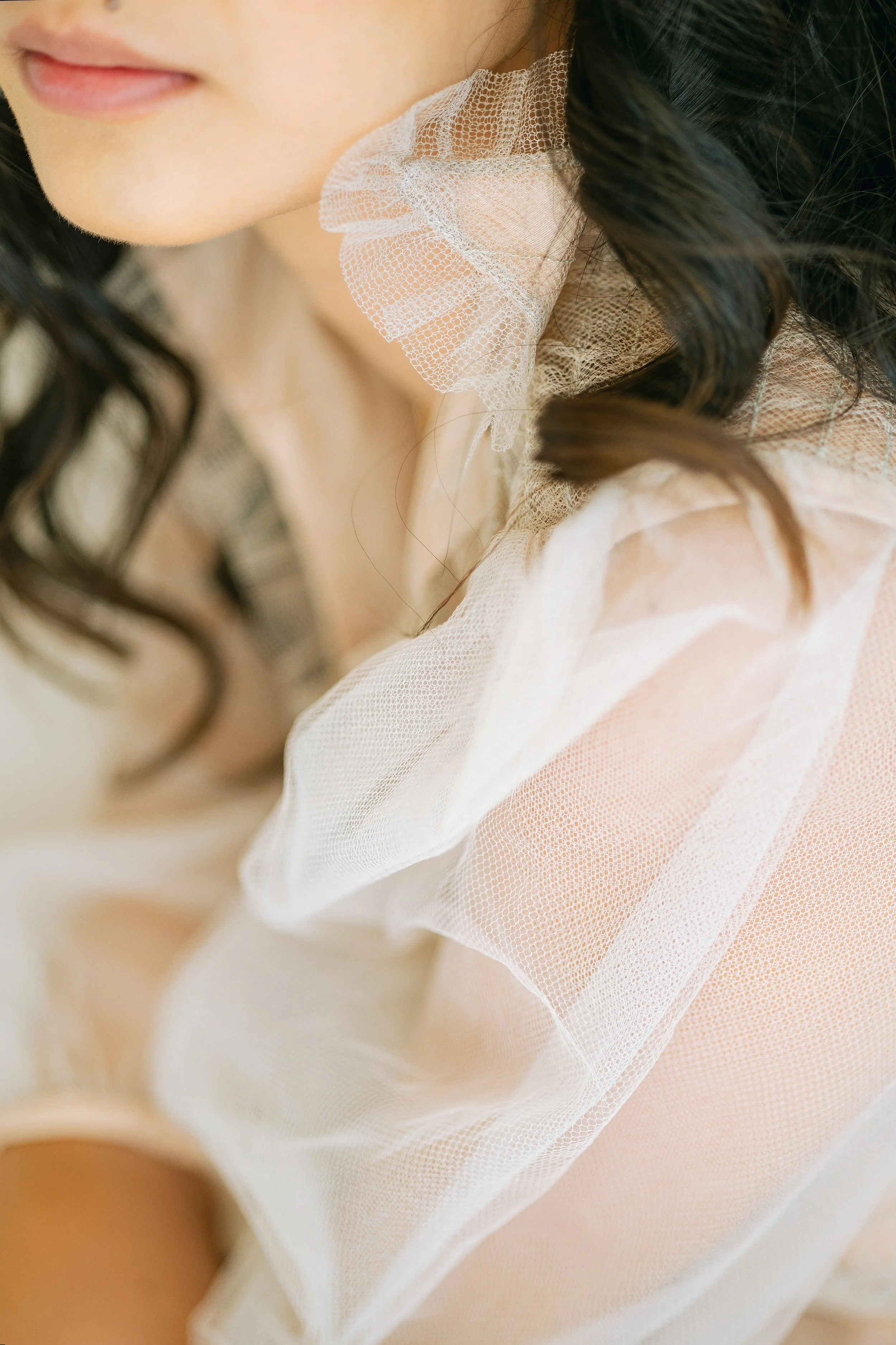 The collar of a woman wearing lace
