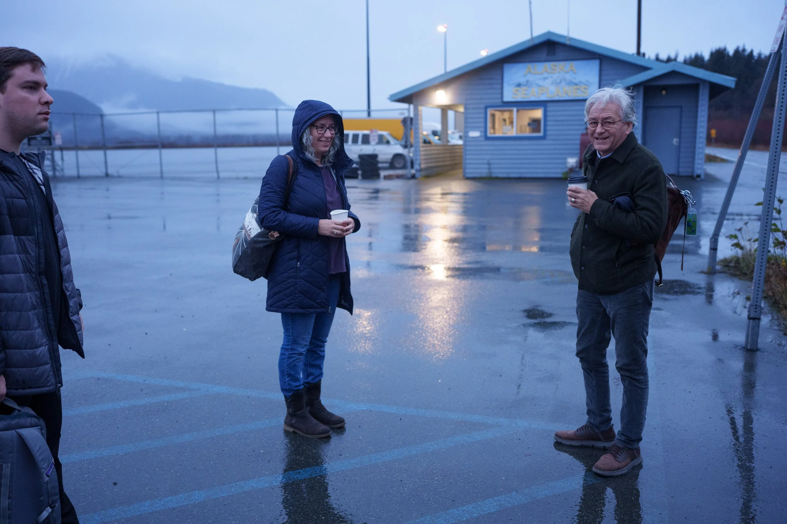 Tom waiting for plane_in rain_smile.jpg