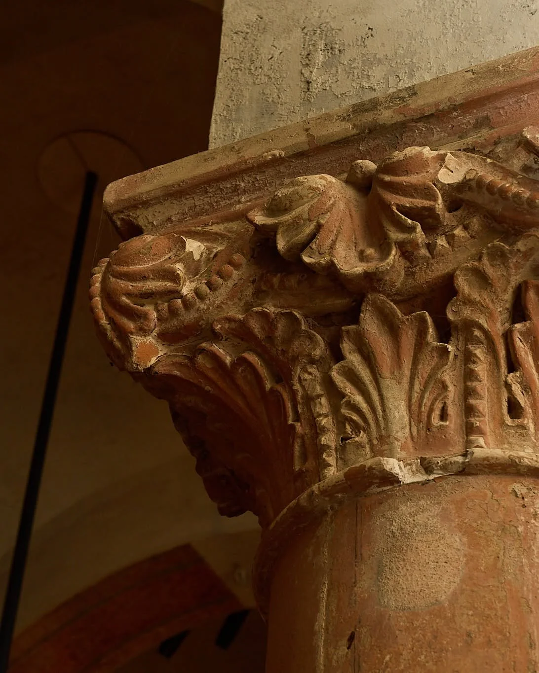 The history of this building is written in its walls, and we chose to honor it. Before our transformation, these rooms were painted in a deep red&mdash;a design decision from the 1990s. Our team carefully removed the paint, uncovering the original hu