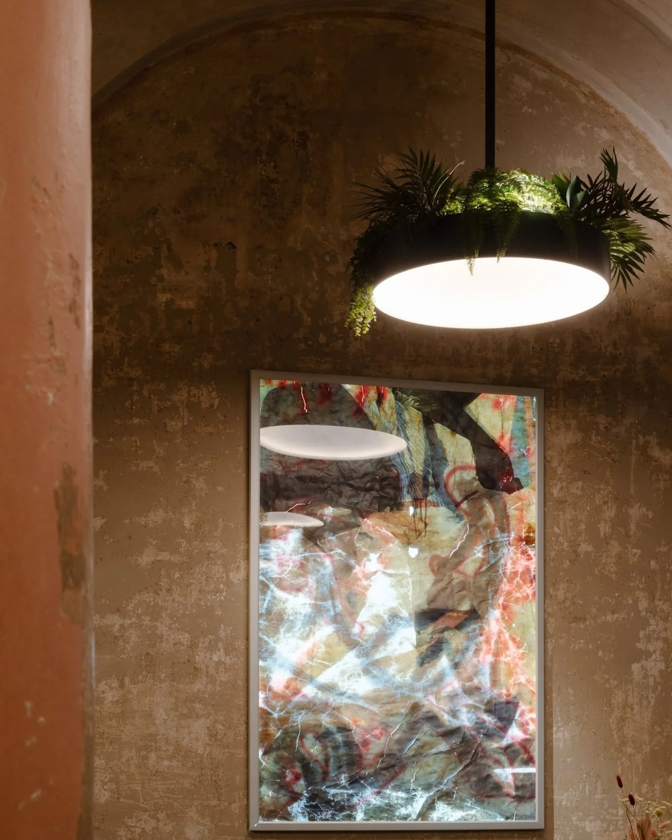 Transformation is at the heart of my design. This mortuary chapel once marked endings, but today, it celebrates new beginnings. 

The lamps you see here are more than lighting&mdash;they're symbols of rebirth, dressed in lush greenery to represent li