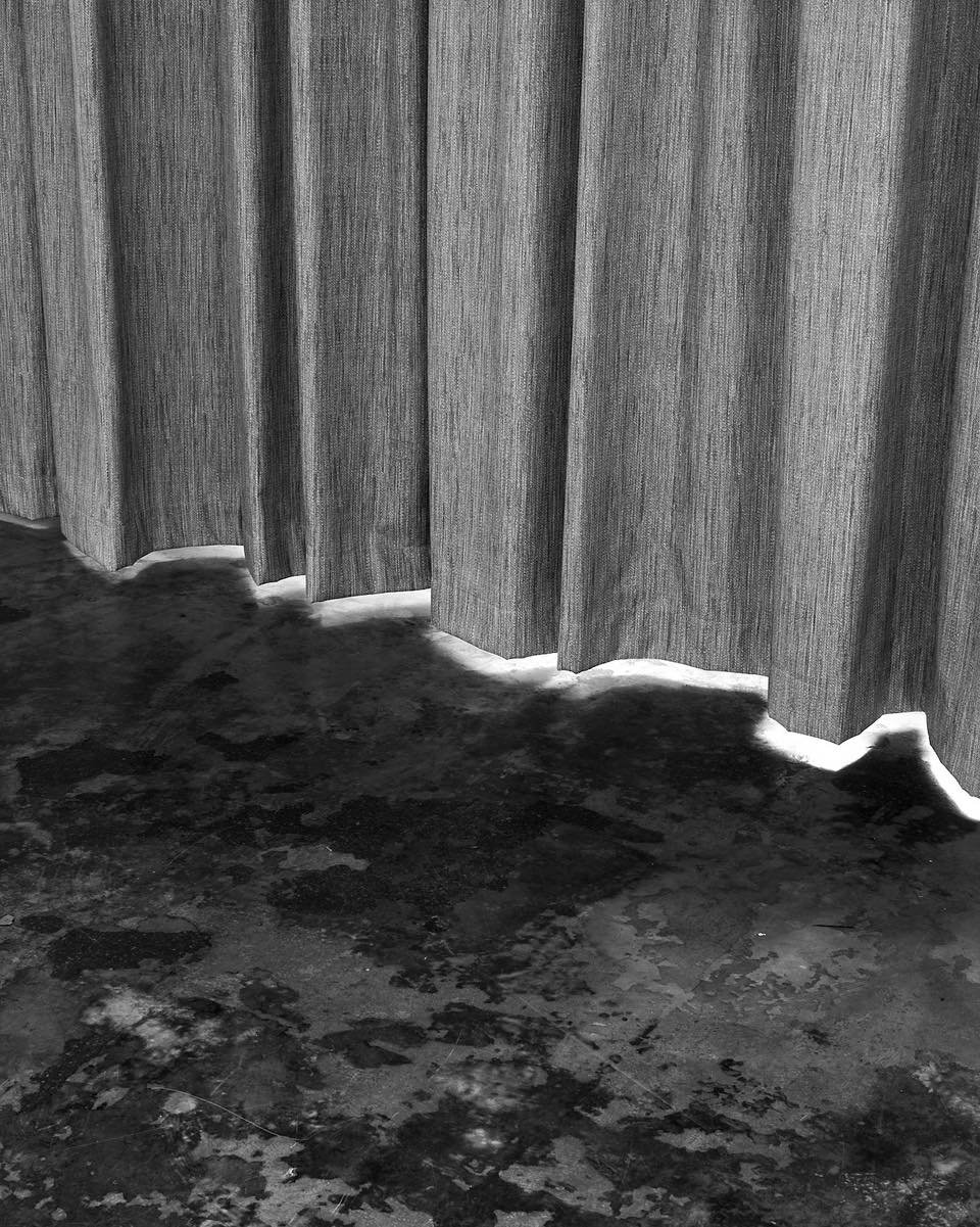 Textural harmony&mdash;softness meets the rugged. This combination of a natural fabric curtain against an imperfect floor creates a unique sense of balance. It&rsquo;s all about blending the organic and the urban, bringing a sense of calm to city liv